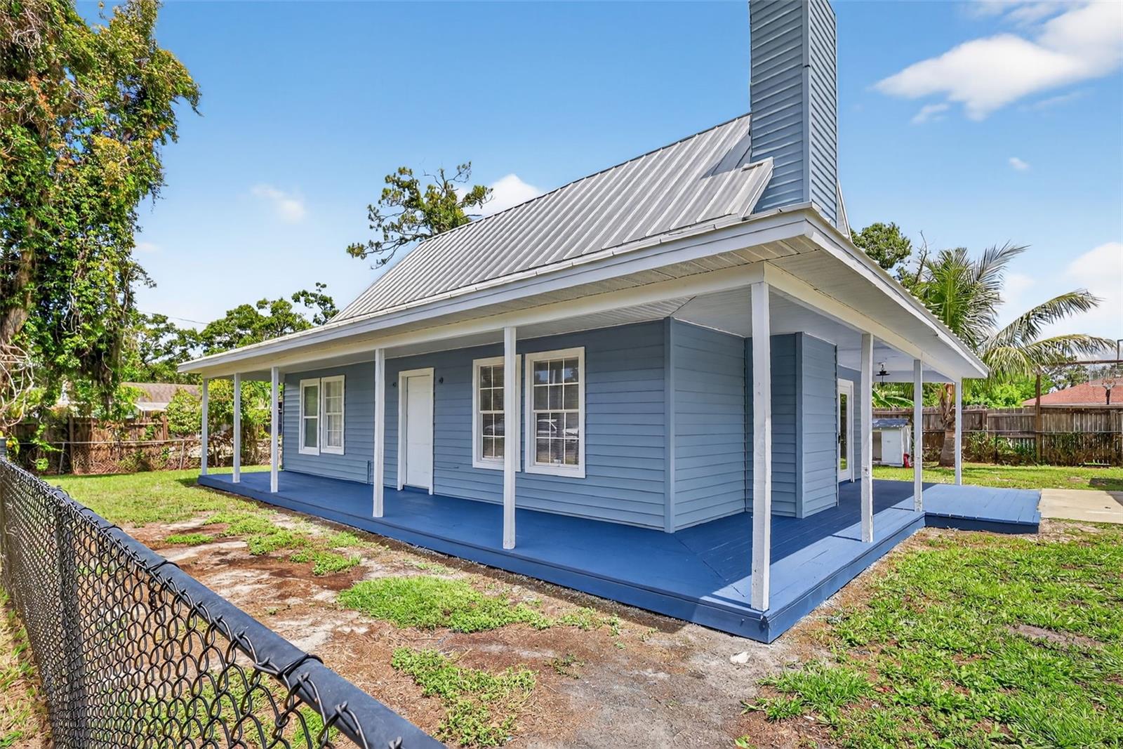 Welcome to this unique, 2 story, A-Frame style Bradenton home that has been recently remodeled featuring 3 bedrooms, 2 bathrooms including a 4 car garage with a seamless Metal Roof that was installed in 2022 and features a wrap-around wooden deck and a fully fenced yard located on this No Flood Zone .28-acre corner lot with no HOA or Deed Restrictions! The home was recently TENTED for termites on June 17, 2025, and has a transferable bond warranty for the new owners. The recent renovations include having the interior and exterior professionally painted including the kitchen cabinetry, new 4 inch base molding and NEW Frigidaire Stainless Steel appliances. Other improvements include a rebuilt and painted deck along with new exterior window trim. Upon entering the front door of the home, you will notice the soaring ceilings and open concept including a wood burning fireplace and wood look ceramic tile flows throughout the entire house making cleaning a breeze after those long beach days. From the garage enter through the glass French Doors directly into the remodeled kitchen, which is truly the heart of the home featuring Shenandoah cabinets with soft close doors and drawers, a built-in wine rack, Granite counters, and new Brushed Nickel hardware! There are 2 bedrooms and a bathroom with a tub/shower located on the 1st floor. The 2nd bedroom is larger and features a light fixture/ceiling fan and a closet with an abundance of natural light. The laundry hook-ups and plumbing for an additional sink are located in the 3rd bedroom, which was used as a hair salon. Located on the 2nd floor is the master bedroom with an ensuite bathroom featuring a glass enclosure step in shower and an open closet with additional storage area and with a light fixture/ceiling fan. There is easily room for a pool and the yard can provide an abundance of entertainment for family events. Use your imagination for the oversized 768 square foot, versatile 4 car detached garage as you see fit to store your vehicles, use as a workshop or storage of lawn equipment or convert it into more living space for multi-generational families. The possibilities are endless! So, bring the boat or RV as there is plenty of room for all of the toys. Lastly, the location is only steps away from Samoset Elementary School and within 30 minutes of Anna Marie Island and the best restaurants and shopping with an easy commute to US-301 & I-75. This truly is a stellar property, schedule your showing today!