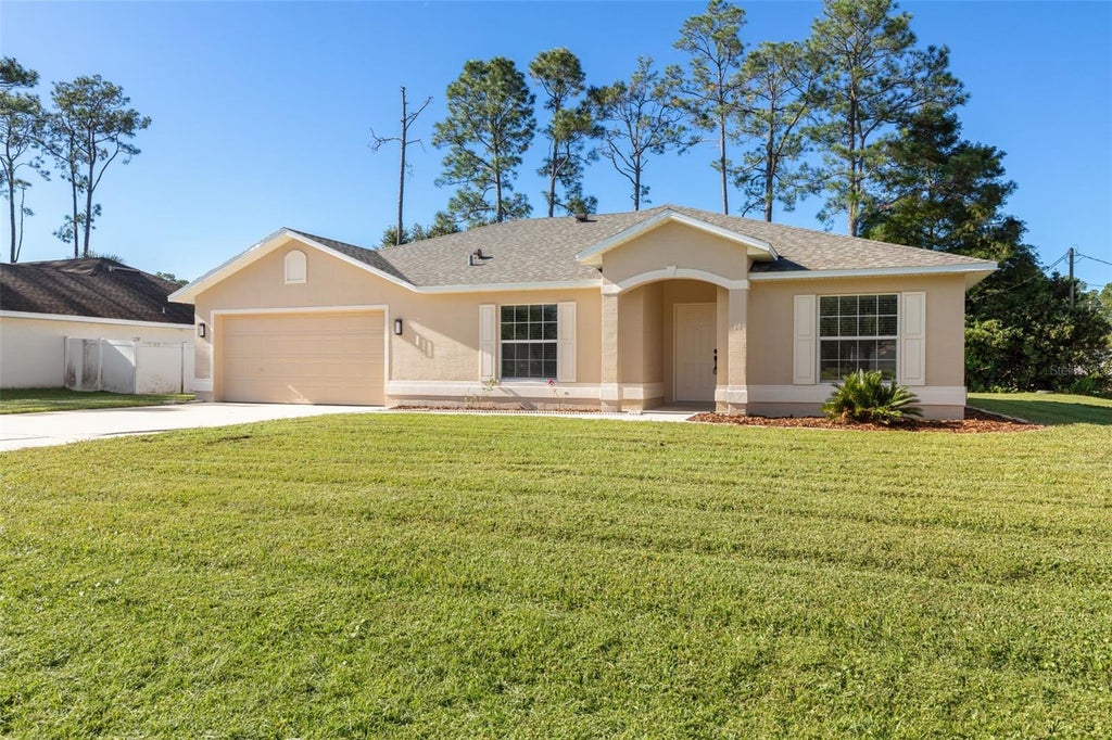 Photo of 46 Rickenbacker Drive, Palm Coast, FL 32164 (MLS # FC322001)