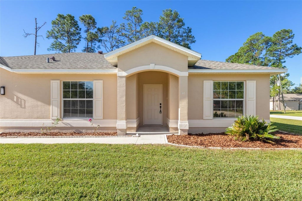 Photo of 46 Rickenbacker Drive, Palm Coast, FL 32164 (MLS # FC322001)