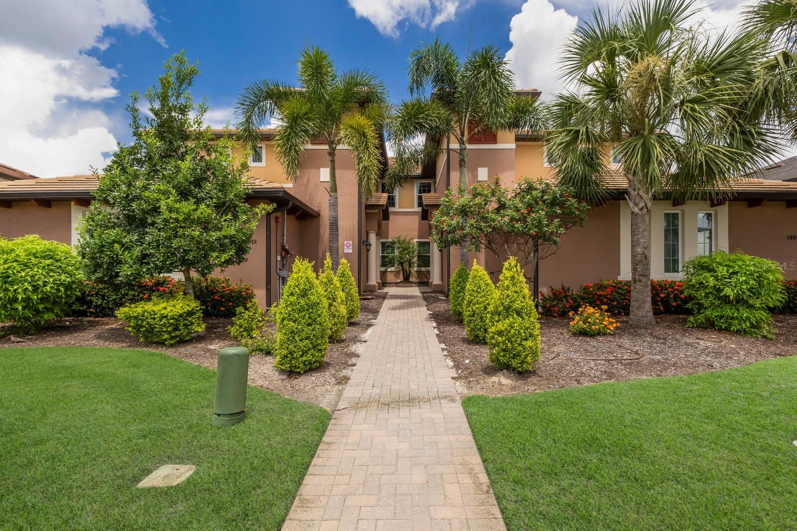 Enjoy resort-style living in this elegantly upgraded 3-bedroom, 2-bath condo with an oversized den. This move-in ready upper-level residence features a private in-unit elevator from the garage directly to the main living area, providing everyday ease and convenience. The open-concept floor plan provides panoramic views of the golf course practice green and club house from the kitchen, dining area, living room, and lanai—perfect for enjoying sunsets and peaceful mornings. The spacious master suite offers serene golf course views, dual closets, a private water closet, dual vanities, and a generously sized walk-in shower. Two guest bedrooms are ideally situated on the opposite side of the home with a full bathroom in between, providing privacy and comfort for guests. The oversized den/study adds flexibility for a home office, media space, or additional sleeping area. Refined upgrades throughout include crown molding, detailed ceiling trim, designer lighting, and more. The kitchen features a walk-in pantry and a gas cooktop—ideal for any home chef. A spacious laundry room includes built-in cabinetry and a utility sink for added convenience. The freshly sealed two-car garage offers plenty of storage and a clean, polished finish. All properties are currently being freshly painted, enhancing their move-in ready appeal. The home feels exceptionally private, quiet, and relaxing, with abundant natural light and tranquil views. Country Club East is a gated community with amenities including three pools, a fitness center, and a clubhouse. Conveniently located near an abundance of shopping, dining, both Sarasota and Tampa airports, as well as some of the nation’s most beautiful beaches. Optional membership to the Lakewood Ranch Country Club offers access to four golf courses, three restaurants, pickleball, tennis courts, and more. This is Florida living at its finest—luxurious, low-maintenance, and perfectly located.