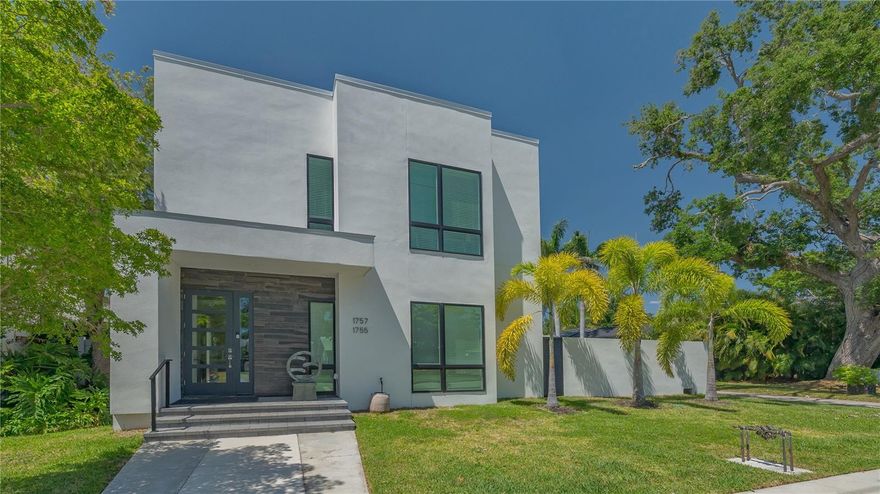 TWO LUXURY ADA-COMPLIANT RESIDENCES UNDER ONE ROOF.  THREE CAR GARAGE, ELEVATOR, SOLAR, NATURAL GAS.Welcome to one of Gillespie Park’s most extraordinary finds—a sleek, contemporary MULTI-GENERATION residence or INCOME PRODUCING INVESTMENT just steps from downtown Sarasota! This 2023 custom-built two-story home offers over 4,400 sq. ft. of luxurious living space, thoughtfully crafted for two households to live independently yet connected, or easily transformed into a spacious single-family retreat. • TWO FULL 2200 SQ.FT. RESIDENCES: Each floor boasts a 2 bed / 2 bath ADA-compliant layout, soaring 10-ft ceilings, and abundant natural light with motorized blinds, downstairs surround sound. • Gourmet Kitchens: Downstairs: Thermador appliances, 6-burner gas cooktop, dual dishwashers, walk-in pantry, and a stylish coffee/wine bar, laundry room. Upstairs: Bosch appliances, laundry room, and two ensuite bedrooms. • Outdoor Living: Ground Floor courtyard with outdoor kitchen, hot tub, and lush privacy walls. Expansive Second Floor Balcony is partially covered, perfect for relaxing or entertaining. • Energy Smart: Natural Gas tankless hot water heaters. Solar panels currently power the second floor but can be switched to the ground level. • Rare 3-Car Garage with rear alley access—one of the few blocks in Gillespie Park with this feature. • Elevator + Wide Stairwell for seamless access between floors. • Zoned for Short-Term Rentals – a golden opportunity for investors! • Gillespie Park Amenities: Dog run, tennis courts, and a vibrant community vibe. • Walkable Lifestyle: Minutes from the Rosemary Arts District, downtown dining, shopping, and theaters.