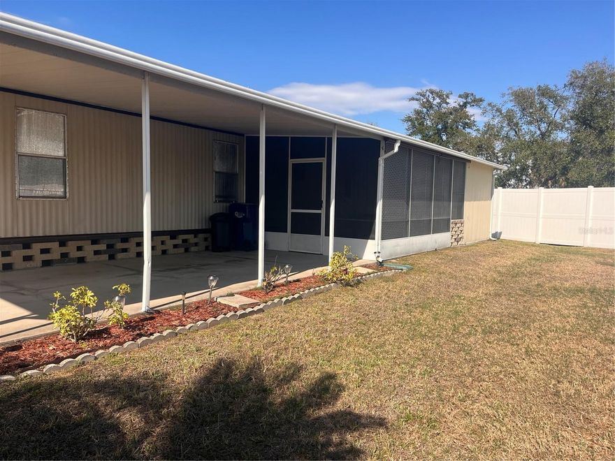 Very nice 3 bedroom one full bath and a half bath that is connected to the 2nd and 3rd bedrooms. The primary bedroom is split from the other two bedrooms. Bedroom 3 is currently used as an office.  Laminate flooring through out the unit. The fully enclosed lanai has carpet, glass windows and a wall a/c unit. There is a separate screened lanai behind the covered carport. The storage unit has the washer/dryer and a laundry tub. The range is propane gas. The kitchen is open to the living room and the dining room to give a more spacious feel. The unit has hurricane shutters and extra window treatments which are down so the unit is dark. When they are off the unit is very comfortable and light. Fully furnished and move in ready. Check it out today.