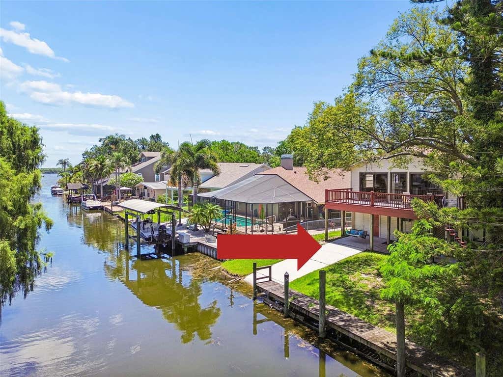 Photo of 3141 N Canal Drive, Palm Harbor, FL 34684 (MLS # TB8518778)