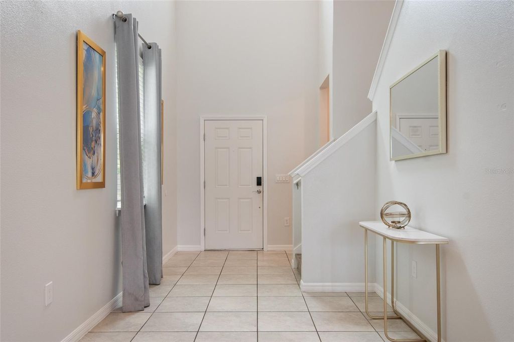 Photo of 7364 Oakmoss Loop, Davenport, FL 33837 (MLS # O6382626)