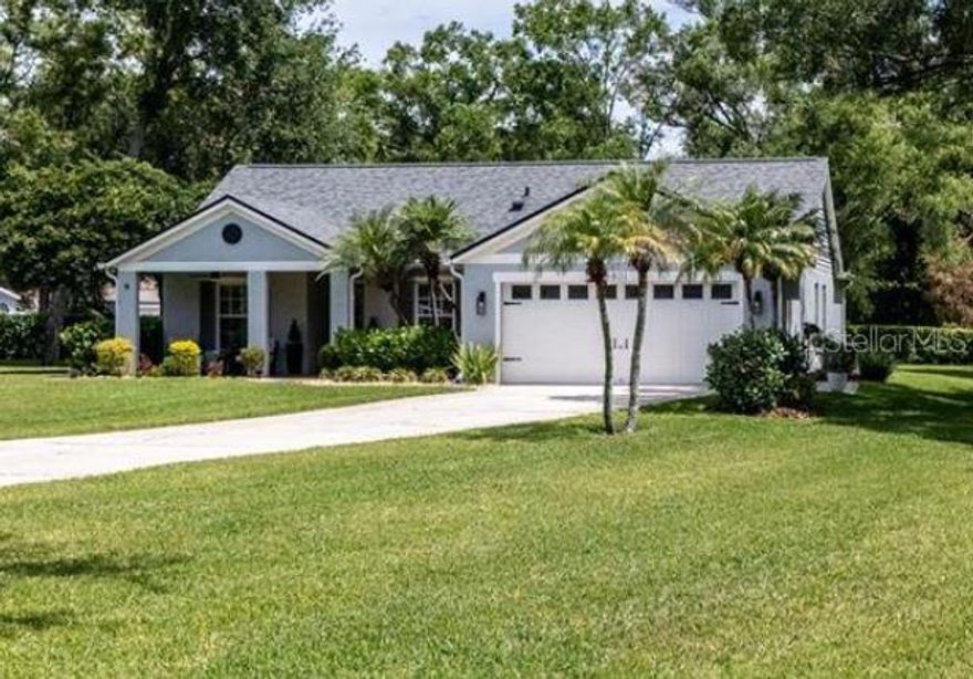 Perfectly manicured and meticulously maintained, this charming 4-bedroom, 2-bath home with a full 2-car garage sits on a stunning conservation lot at the end of a quiet cul-de-sac—offering rare privacy and peaceful surroundings. Positioned on a spacious corner lot, the outdoor space is truly a standout, featuring a covered stone paver patio and lush tropical Florida landscaping that creates a serene, resort-like atmosphere—perfect for relaxing or entertaining. Inside, the home has been fully customized and beautifully remodeled, showcasing vaulted ceilings and a bright, open floor plan designed for modern living. The kitchen is both stylish and functional, complete with stainless steel appliances, a granite breakfast bar, and a sunny breakfast nook with picturesque views—an ideal spot to start your day. The expansive primary suite serves as a private retreat, featuring a walk-in closet and an elegant marble walk-in shower that adds a touch of luxury. New roof in 2022.  Located in the highly desirable Brookshire Estates, this home offers unbeatable convenience—just minutes from the Veterans Expressway, Citrus Park Mall, and an array of dining and shopping options.