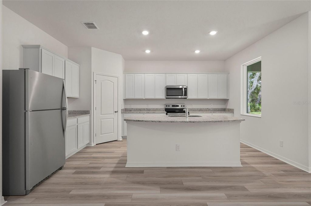 Photo of 539 Peace Drive, Poinciana, FL 34759 (MLS # TB8440229)