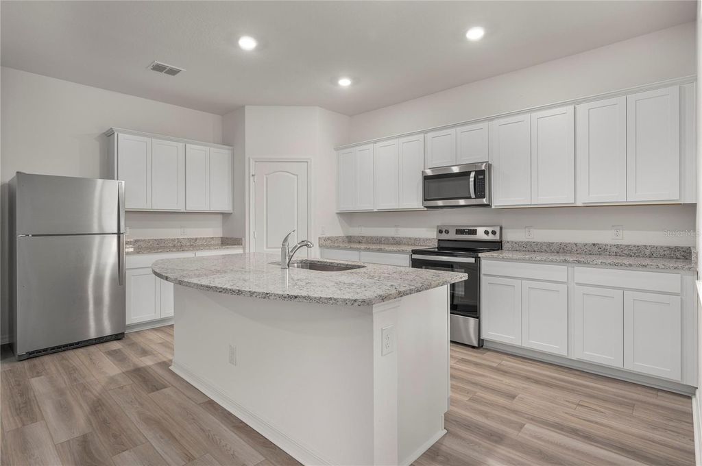 Photo of 539 Peace Drive, Poinciana, FL 34759 (MLS # TB8440229)
