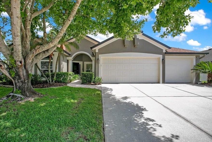 One or more photo(s) has been virtually staged. Welcome to 2405 Blossomwood Drive, a beautifully updated pool home located in the highly sought-after Tuska Ridge community of Oviedo. Offering 4 bedrooms, 3 bathrooms, and 2,333 square feet of thoughtfully designed living space, this move-in-ready residence combines timeless style, modern upgrades, and the Florida lifestyle today's buyers are searching for.

From the moment you arrive, you'll appreciate the pride of ownership reflected throughout the property. Major improvements have already been completed, providing exceptional value and peace of mind, including the ROOF (2017), REPLACEMENT WINDOWS (2017), UPDATED PRIMARY SHOWER (2017), STAINLESS STEEL APPLIANCES (2018), EXTERIOR PAINT (2022), HVAC SYSTEM (August 2023), WATER HEATER (August 2023), POOL RESURFACING (2023), and a POOL LIGHT (May 2026).

Inside, soaring ceilings, abundant natural light, and an open, inviting layout create the perfect setting for both everyday living and entertaining. The kitchen features elegant quartz countertops, stainless steel appliances, ample cabinetry, and a functional design that flows seamlessly into the living and dining areas.

The split-bedroom floor plan offers privacy and versatility for a variety of lifestyles. The spacious primary suite serves as a relaxing retreat with an updated shower, while one of the secondary bedrooms features its own private en-suite bath, ideal for guests, multigenerational living, or a private home office suite. A third full bathroom offers direct access to the pool area, providing the convenience of a dedicated cabana bath for outdoor entertaining and poolside enjoyment.

Step outside to your private backyard oasis, where a screened pool, covered lanai, and mature landscaping create the perfect environment for relaxing weekends, family gatherings, and year-round Florida living. Enjoy the resurfaced pool and non-slip surface finished designed to enhance comfort and safety, while the fully fenced yard provides additional privacy.  The spacious 3-car garage offers ample room for vehicles, storage, and recreational equipment.

The Energy Star double-pane windows help improve efficiency, reduce outside noise, and contribute to year-round comfort. Combined with the newer HVAC system and water heater, these updates allow buyers to move in with confidence knowing many of the home's major improvements have already been completed.

Located within Seminole County's highly regarded school district and just minutes from shopping, dining, parks, and major commuter routes, this exceptional home offers the perfect blend of location, comfort, and long-term value.

With the major updates already completed, all that's left to do is move in and start enjoying everything this beautiful Oviedo home has to offer.