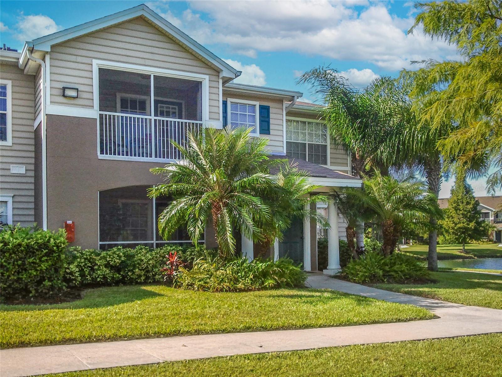 This is an unfurnished second floor 2 bedroom 2 bath corner-unit condo in The Village at Townpark! This end-unit features picturesque pond views from every window, vaulted ceilings, luxury vinyl wood plank flooring in the kitchen, dining room, and bathrooms and carpet in the bedrooms and living areas. The eat-in kitchen has a breakfast bar and granite countertops. The open-concept living area provides access to a screened balcony overlooking the community's serene pond with water fountains. The master suite boasts ample windows, a walk-in closet, and an en suite bathroom. A second spacious bedroom is located across the hall and also has a walk-in closet and shares a guest bathroom. A full-size washer and dryer are included within the unit for convenience. Trash removal, grounds maintenance, and pest control are included. Pets are not permitted. The Village at Townpark provides various amenities, including a community pool, fitness room, clubhouse, tennis courts, volleyball courts, a playground, and a car wash area. Located in Lakewood Ranch, this community is not far from Main Street, offering shops, restaurants, a movie theater, and mini golf. Please allow up to 2 weeks after lease signing for community approval before move-in. We score every application. If an application doesn’t score high enough, the resident may be required to place the equivalent of two months’ rent in a security deposit. This home is being leased by Sarasota Management & Leasing, however it will be managed by the owner.