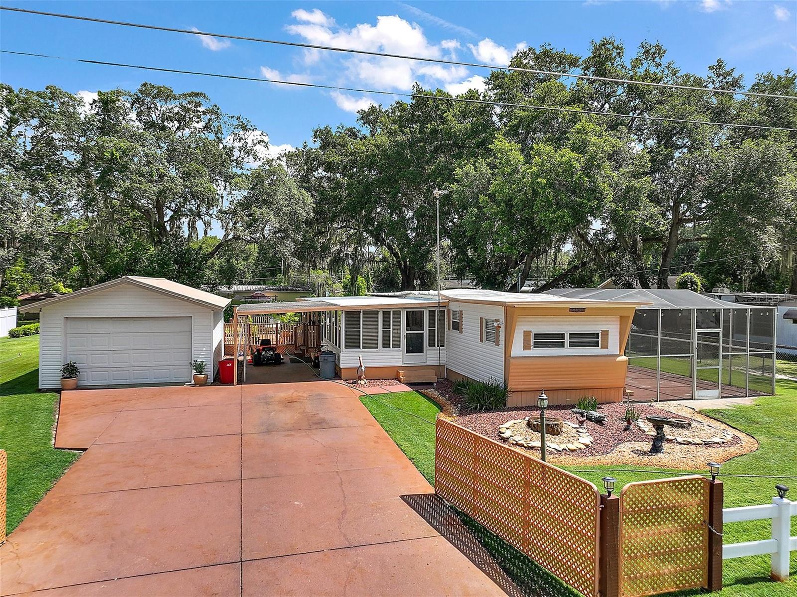 CASH ONLY! This is a must-see....1966 mobile home that has been very well maintained inside and out IS BEING sold TURN-KEY. The house is situated off the main road leading into Mobile Home Meadows subdivision, located on 99th Ave, on a dead-end street for added peace, quiet, and privacy. Mobile home Meadows subdivision located in Summerfield FL just minutes from shopping, dining, medical and so much more This property won't last long with the single car detached car/workshop, 18 x 12 glass enclosed Florida room and large back deck that is 1/2 covered and 1/2 open to be enjoyed no matter what the FL weather has in store and large birdcage on the opposite side of the house. The stove and microwave are new, accompanied by upgraded mini blinds throughout the home. Additionally, there are two sets of sliding glass doors, one opening to the Florida room and the second set opening onto the covered area of the back deck. Make your appointment while this gem is available to start your family, a convenient area to live, or a winter retreat.