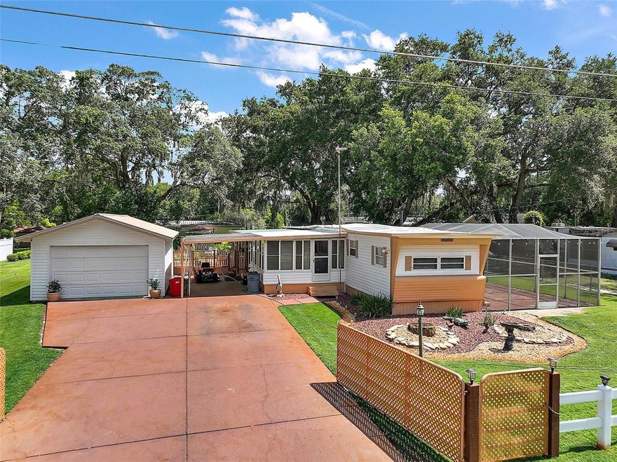 CASH ONLY! This is a must-see....1966 mobile home that has been very well maintained inside and out IS BEING sold TURN-KEY. The house is situated off the main road leading into Mobile Home Meadows subdivision, located on 99th Ave, on a dead-end street for added peace, quiet, and privacy. Mobile home Meadows subdivision located in Summerfield FL just minutes from shopping, dining, medical and so much more This property won't last long with the single car detached car/workshop, 18 x 12 glass enclosed Florida room and large back deck that is 1/2 covered and 1/2 open to be enjoyed no matter what the FL weather has in store and large birdcage on the opposite side of the house.   The stove and microwave are new, accompanied by upgraded mini blinds throughout the home. Additionally, there are two sets of sliding glass doors, one opening to the Florida room and the second set opening onto the covered area of the back deck. Make your appointment while this gem is available to start your family, a convenient area to live, or a winter retreat.