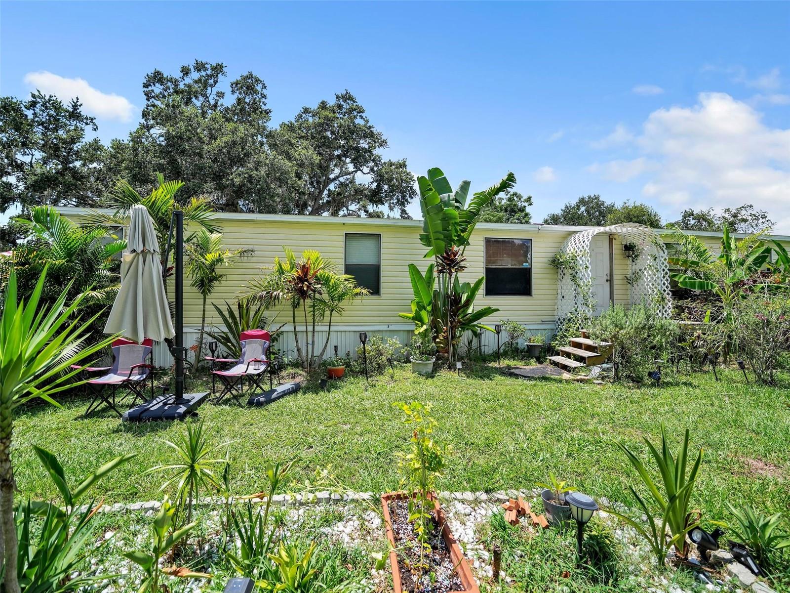 This well-maintained 4-bedroom, 2-bath manufactured home offers the perfect blend of comfort, updates, and outdoor living. Situated on almost a half an acre of land, the home features a 2017 roof, 2017 water heater, and a 2022 HVAC system for peace of mind. Inside, you’ll find tasteful updates including new flooring, backsplash, and light fixtures.
The split floor plan offers privacy, with a primary suite that includes a walk-in closet and en-suite bath. The kitchen and separate dining space flow easily into the living room, making it ideal for gatherings. Enjoy the convenience of an indoor laundry room and the bonus of a screened-in back porch — perfect for relaxing after a swim in the above-ground pool.
Outside, there’s plenty of space for activities, plus a storage shed for all your tools and gear. This move-in ready property combines modern updates, great outdoor features, and a spacious lot — all at an incredible value, not to mention the location is more than ideal. You are minutes from all the local shopping and entertainment, medical facilities, as well as quick access to the interstate providing ease to your travel to Tampa or Orlando.
Schedule your showing today and see for yourself all this property has to give.