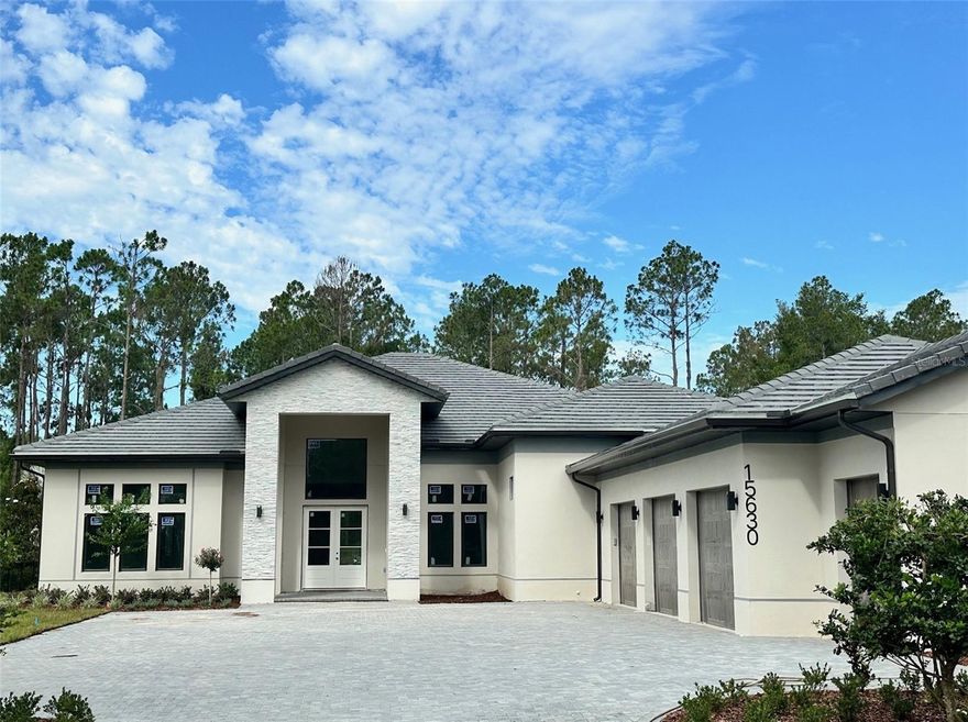 Under Construction. Late August 2024 delivery. As you enter this beautifully designed contemporary home crafted by Primo Homes you are greeted by an expansive double door entry leading into the open great room with view of the custom pool/outdoor living and preserve area. Sleek architectural lines surround the interior with high ceilings, 10 ft sliding doors, oversized porcelain tile throughout, and wine wall. The gourmet kitchen features Fisher  & Paykel appliances with  gas range, wall oven and wall microwave. Built in shelving enhances the modern kitchen design. The spacious master retreat offers an expansive custom walk in closet, oversized master shower, double vanities and free standing soaking tub. Enjoy the separate game room/family room with double pocket sliding doors opening to the oversized covered lanai area. Enjoy the custom designed pool with spa, outdoor kitchen making it perfect for entertaining family and friends. The 3.5 car garage is perfect for extra storage space or golf cart parking. Enjoy the many amenities The Club at Bella Collina has  including two restaurants with indoor/outdoor patio dining, outdoor pool complex, fitness center with classes, spa, Har-Tru tennis complex and Nick Faldo designed 18 hole Championship golf course. Social and culinary events are held year round. Call today to set your appointment to preview this magnificent home and all that Bella Collina has, $40,000 Sports Membership Deposit is deferred to Buyer from the Developer at closing