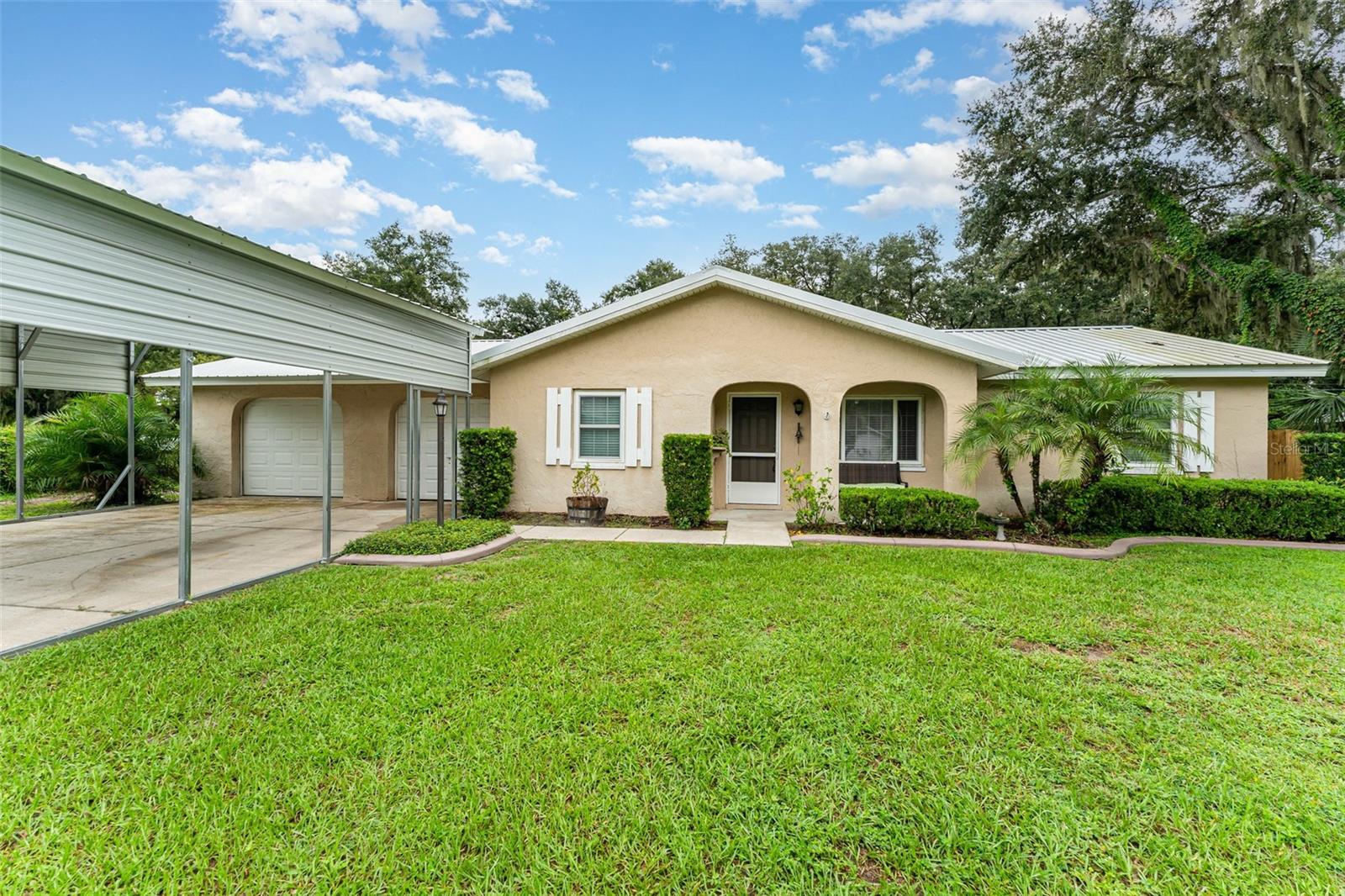 Charming Corner-Lot Home with Exceptional Features!
Welcome to this beautifully maintained 3-bedroom, 2-bath residence, perfectly positioned on a
desirable corner lot. Thoughtfully designed for both comfort and functionality, this home offers a
lifestyle that is as practical as it is inviting.
The stylish kitchen is the heart of the home, appointed with stainless steel appliances and plenty
of space for everyday living and entertaining. A versatile garage with dual front-and-rear entry,
paired with a two-car carport, ensures ample parking and convenience.
Step outside to a screened-in patio—ideal for unwinding at the end of the day—or enjoy the
expansive fenced backyard. Here, you’ll also find a detached workshop/playroom complete with
its own bathroom, providing endless possibilities for hobbies, a private office, or guest space.
With its unique combination of charm, flexibility, and modern amenities, this home is move-in
ready and waiting for you.