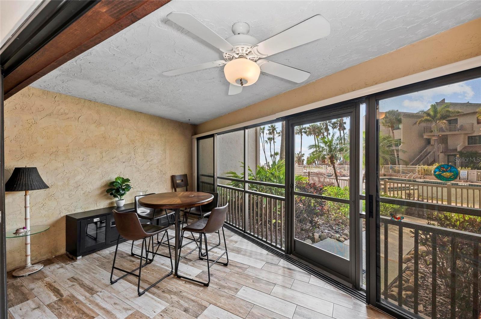 Nestled in the sought-after MIDNIGHT COVE community on the beachside of Siesta Key, this charming condominium offers the perfect blend of beachfront living and modern convenience. BEST NEWS OF ALL - - NO HURRICANE DAMAGE, WATER OR SAND IN THIS UNIT! Located at 6342 Midnight Pass Road, this unit is part of a gulf-to-bay property renowned for its prime location just steps from the powdery sugar sand of Crescent Beach. Featuring 2 bedrooms and 2 bathrooms, this ground level condominium offers direct access to the pool and beachfront from the spacious glassed-in lanai. Enjoy ground level, direct pool access (anticipated to be open this summer) and partial views of the Gulf of Mexico. The property also features a bright living and dining area, a kitchen with a breakfast bar, in unit washer/dryer and a master suite with updated ensuite bathroom. Additionally, there is a 2nd bedroom and 2nd bathroom with convenient access from the living area The condo is designed for low-maintenance, casual living, with access to resort-style amenities including two community pools, tennis courts, private beach access, boat dockage, a fitness room, and barbecue areas—all within a gated, maintenance-free environment. Interested in renting your property? Midnight Cove has a fabulous, well managed onsite rental office for complete care of your property and rental guests. Many guests return year after year which makes this a rare opportunity to invest in one of Florida’s most desirable locations on one of the top beaches in the world. Midnight Cove’s location is unbeatable—just minutes from Siesta Key Village, where you’ll find boutique shops, fine dining, and vibrant nightlife. The property is also conveniently located 20 minutes from Sarasota-Bradenton International Airport and an hour from Tampa International Airport, making it an ideal primary residence, vacation home, or investment property with strong rental potential. Seize the opportunity to own and/or vacation in paradise! RENTAL HISTORY IS AVAILABLE! LOOKING FOR A 1031 EXCHANGE PROPERTY? CHECK IT OUT!.