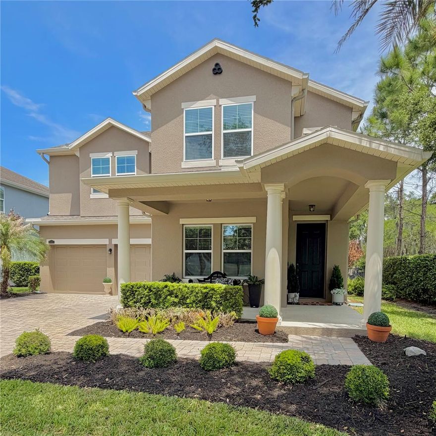WELCOME to this stunning 4-bedroom, 2.5-bathroom home offering 2,931 square feet of thoughtfully designed living space, perfectly situated on a premium conservation lot across the street from a park, with a green space on the right and overlooking a peaceful and picturesque inlet off Lake Burnett. Framed by majestic oak trees draped in Spanish moss, the setting provides both privacy and breathtaking natural beauty. As you enter, you are greeted by an elegant dining room featuring a custom accent wall, setting the tone for the home’s stylish design. Double doors to the left open into a versatile office or flex space, ideal for working from home or creating a quiet retreat. The entire first floor showcases tile flooring, combining durability with a clean, polished look. Toward the back of the home, the kitchen and great room are perfectly positioned to capture serene views of the screened lanai, the beautifully landscaped yard, tranquil inlet and majestic oak trees. The spacious kitchen features 42-inch cabinets, a large kitchen island, and stainless steel appliances, creating a functional and inviting space ideal for both everyday living and entertaining. The seamless flow into the great room enhances the open-concept design, making it the true heart of the home. Natural light pours in through numerous windows, each enhanced with custom window casings, while crown molding throughout the home adds a refined architectural touch. As you make your way upstairs, you’ll notice decorative wall niches accented with molding that beautifully matches the window casings, adding character and architectural interest to the space. Upstairs, luxury vinyl plank flooring extends seamlessly through the game room as well as all of the bedrooms and closets, offering both style and functionality. The spacious primary suite is a true retreat, complete with a charming bench window seat. The en suite bathroom features a walk-in shower, double vanities, soaking tub, and a generously sized walk-in closet. The additional bedrooms are impressively sized, with two offering walk-in closets, providing ample storage for family and guests. Step outside to enjoy Florida living at its finest on the screened lanai, overlooking the serene inlet and lush landscape. The fully fenced yard features an aluminum fence with gates on both sides, blending security with unobstructed views of the natural surroundings. The exterior has been freshly painted, and the home includes a new water heater, gutters with premium LeafGuard protection, and is pre-wired for a security system for added peace of mind. Located in the highly desirable gated community of Hickory Hammock, residents enjoy resort-style amenities including a swimming pool, sand volleyball court, playground, tennis courts, a 3,600-square-foot clubhouse with catering kitchen and meeting spaces, as well as a community park. This home beautifully combines elegant style, comfort, and a one-of-a-kind setting. Don’t miss the opportunity to make 15665 Citrus Harvest your HOME!
