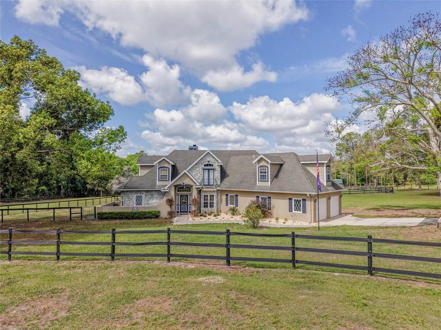 A true HIDDEN GEM, FRENCH FARMHOUSE STYLE offering unparalleled serenity and luxury. Offered for the first time by its original owners, this custom-built estate sits on 11 MOL private acres and boasts breathtaking views of the rolling hills stretching from Dade City toward Orlando.
This 2007-built home was designed for ultimate privacy, featuring no rear neighbors and only one neighbor to the side. 

The interior offers a thoughtful layout including: - 3 spacious bedrooms and 2.5 bathrooms - A dedicated home office - An expansive bonus room (easily convertible to a 4th bedroom) - Exquisite craftsmanship and two cozy wood-burning fireplaces, including one in the primary suite, abundance of storage opportunity and closets - An open floor plan with a kitchen, dining, and living room combo.

The CHEF's KITCHEN features beautiful custom designed PINE cabinets, granite countertops, gas range, and plenty of storage in your large pantry!!

The outdoor oasis features a screened-in pool overlooking picturesque pastures and wooded vistas. Pebble Tec pool surface with a LIFETIME guarantee. OUTDOOR lover's dream with daily turkey and deer sightings. For equestrian enthusiasts, this fully fenced estate is equestrian-ready, featuring 5 horse stalls, a tack room, and a boarding shed—offering a unique opportunity to step into an established boarding operation.

Additional premium features include: -Icynene Insulation throughout for reduced energy consumption -DOUBLE INSULATED WINDOWS -A 500-gallon propane tank - A dedicated RV pad and a 20x20 storage shed. This exceptional property offers a rare combination of luxury, privacy, and versatility. It is ideal for RV owners, hobbyists, gardening or those seeking a private family compound. 
Please let me know if you would like to schedule a private tour or if you have any questions regarding this unique opportunity.