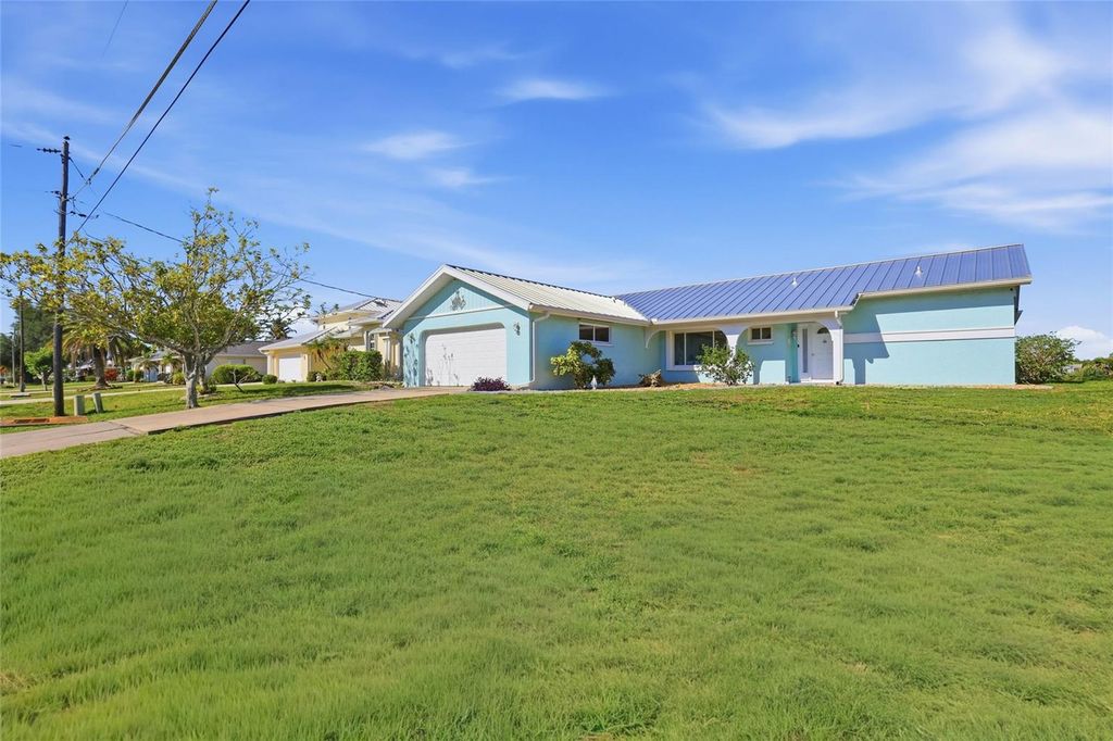 Photo of 414 Spring Lake Boulevard NW, Port Charlotte, FL 33952 (MLS # A4690380)