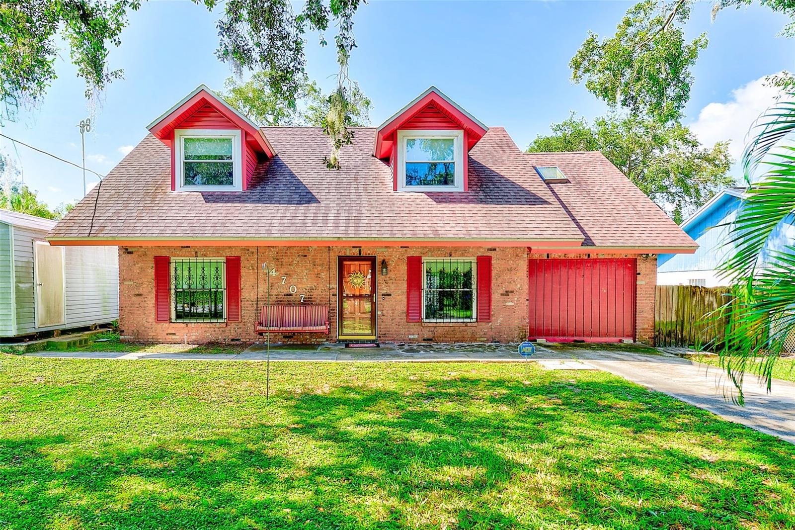 CAN YOU BELIEVE THE OPPORTUNITY TO OWN A HOME IN THE BACKYARD OF THE USF CAMPUS OR CLOSE TO ALL OF THE AMAZING FUN AT BUSCH GARDENS BUT HERE IT IS! THIS HOME WOULD NORMALLY BE FOUND IN THE MOUNTAINS OF NORTH CAROLINA WITH THE COUNTRY FEEL BUT THIS 3 BEDROOM WITH 2 FULL BATHS AND 1 CAR GARAGE THAT IS COMPLETELY FENCED AND IS GRACED BY THE MOST BEAUTIFUL SOUTHERN OAKS IN THE TAMPA BAY AREA! MASTER SUITE IS LOCATED ON THE MAIN FLOOR WITH 2 SPACIOUS BEDROOMS AND ANOTHER FULL BATHROOM UPSTAIRS! THERE'S MORE TO THIS PROPERTY THAN MEETS THE EYE...THE HOME FEATURES AN ENORMOUS SCREENED REAR PATIO WITH YOUR VERY OWN CUSTOM TIKI BAR AND OPEN PAD FOR THE BAR B QUE AREA AS WELL! THERE'S ALSO A SHE SHED IN THE REAR YARD WHERE YOUR MOM, DAD OR TEEN COULD SLEEP AND ENJOY THE KITCHEN & BATHROOM PRIVILEGES OF THE MAIN HOME! THE SHE SHED IS AN INSULATED & WIRED 110 VOLT 08 BY 16 BUILDING WITH AIR & UPPER LOFT FOR SLEEPING QUARTERS & OUTLETS, PLUGS & LIGHTS! DO YOU OWN A FEW RV'S...THIS HOME HAS A DOUBLE DOOR ENTRY TO A FENCED AREA AND YOU'LL BE ABLE TO PARK UNDER THE CUSTOM 2 BAY CARPORT WITH ELECTRICITY! THERE'S EVEN MORE WITH THE HUGE 20 X 10 FOOT EXTERIOR BUILDING THAT IS WIRED & CAN BE A GREAT WORKSHOP AND ENORMOUS STORAGE AREA TOO! ANOTHER SMALL SHED IS PLACED CONVENIENTLY IN THE BACK YARD FOR YOUR LAWN EQUIPMENT LEAVING THE GARAGE FOR EXTRA ROOM! ROOF 2013; DOUBLE PANED & INSULATED WINDOWS 2017; UPSTAIRS VINYL SIDING 2020; TERMITE TREATED 2021; MASTER BATH REMODELED 2021! STORM DOOR ON FRONT ALLOWS THE CONVENIENCE OF LOTS OF BRIGHT & LIGHT TO ENTER THE FRONT OF THE HOME! NEWER KITCHEN APPLIANCES TOO! DID I MENTION THERE ARE NO HOA FEES AND NO CDD FEES MAKING THIS HOME INCREDIBLY AFFORDABLE! THIS CHARMING HOME IS AVAILABLE AS SOON AS YOU'D LIKE TO CLOSE!