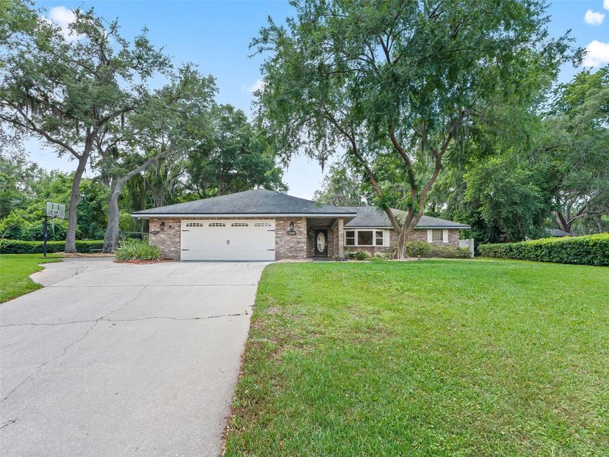 One or more photo(s) has been virtually staged. SILVER LAKE – NO HOA - ESCAPE TO YOUR OWN PRIVATE RETREAT WITH INGROUND UPDATED  POOL, ABOVE GROUND SPA, PAVERS AND VIEW OF WOODS.  THIS CUSTOM 3/3 IS LOCATED ON A CUL-DE-SAC .45 ACRE LOT WITH AMPLE ROOM FOR EXTRA PARKING, BASKETBALL AREA AND LARGE YARD FOR ACTIVITIES.  Step inside to find beautiful engineered hardwood floors, large living/dining room area, cathedral ceilings, crown molding.  KITCHEN has been updated with maple cabinetry with crown molding, soft-close drawers, quartz, refrigerator 2023, disposal 2024, stone backsplash, dinette area. PRIMARY BEDROOM has 2 closets, French doors to office/den, crown molding.  OVERSIZED PRIMARY BATHROOM has two separate vanities, updated shower, shoe closet, linen closet and 2 extra clothes closets.  GUEST SIDE OF HOUSE has one bedroom with private bath and access to outside.  An additional bedroom with 2 closets and guest bathroom with tub/shower.  LARGE UTILITY ROOM with soft-close cabinetry, quartz countertops, 2 storage closets, washer/dryer and extra room for freezer/refrigerator. POOL – PAVERS INSTALLED 2021 AND SEALED IN 2025,   SALT CELL AND PUMP FOR POOL 2019,NEW HEAT PUMP FOR POOL 2022, POOL COPLETELY REMODELED  INCUDING NEW MARCITE FINISH,NEW TILE,NEW LIGHT AND SKIMMER IN 2022.  IN FLOOR CLEANING SYSTEM.  ALL DOUBLE INSULATED WINDOWS 2020, SPRINKLER SYSTEM UPDATED 2024.  NEW WATER HEATER 2024, UDATED DRAINFIELD/PUMPED 2024, NEW GARAGE DOOR, OUTDOOR SHOWER, SECURITY SYSTEM.  UTILITY SHED.  DOG RUN AREA WITH VINYL FENCING.  A GREAT CONVENIENT COMMUNITY WITH SILVER LAKE AMENITIES, DOGGIE PARK, TENNIS, RAQUETBALL, TRAILS AND A GREAT PLACE TO RIDE YOUR BIKE AROUND THE 3MILE SILVER LAKE. RESTAURANTS, LAKE SUMTER COMMUNITY COLLEGE, INTERNATIONAL AIRPORT, MEDICAL AND WORSHIP FACILITIES JUST MINUTES AWAY.  CALL TO SCHEDULE YOUR SHOWING TODAY AND YOU WILL BE IMPRESSED