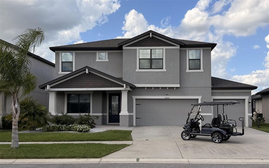 LAKEVIEW!! GOLF CART INCLUDED with signed agreement by May 25th! Stunning Home with expansive Lake views has dual Primary Suites & premium upgrades. This beautifully maintained 2021 built home offers 2,943 sq. ft. of thoughtfully designed living space, 3 car garage and an exceptional blend of comfort, technology & upgrades. Just off the large, gracious foyer is a versatile flex space with beautiful cabinetry, shelves and black diamond granite countertop. Ideal for a home office, creative workspace or playroom. The foyer leads to a large open concept living and dining area featuring a large kitchen island with quartz countertops perfect for entertaining. The upgraded cabinets have crown molding, light rail and under cabinet lighting.  There are beautiful, black and stainless appliances including a dishwasher and water softener installed in Dec 2025. French doors open to a large, private screened lanai including an extended patio with a fully fenced yard looking out over the serene Cabbage Slough Lake! First floor laundry room has cabinets for extra storage. This spacious home features 4 bedrooms including two luxurious primary suites--one located on the first floor with a huge walk-in closet and the other on the second level for extra privacy. There is another full bath, 2 additional bedrooms, a large loft, and an office on the second level. This home is equipped with a built-in 5.1 surround sound system featuring in-ceiling speakers and auxiliary hookups. Also featured are internet connections providing seamless connectivity for a true smart home entertainment experience. This home features beautiful wood look tile through most of first floor and new luxury vinyl plank flooring in first floor primary suite, stairway and all of the second level. There are granite countertops in all bathrooms. There is ample storage areas throughout the home, including a shed for those extra toys and tools! Lot extends beyond back fenceline. The refrigerator in garage is included. This home truly offers the perfect combination of space, upgrades and lifestyle--all set against a peaceful lakeview backdrop. You'll be ready to join the community holiday parades with your 2022 golf cart! The low HOA includes trash pickup, clubhouse with community room, kitchen, pool table, fitness center, locker rooms and large beach entry resort style pool with water features for the kiddos! Close to major highways, hospitals and airports. TVs, Washer, Dryer, Freezer, Tool boxes and tool cabinets in garage do not convey.