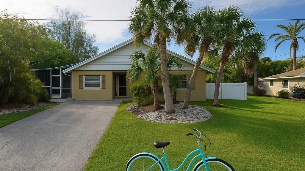 One or more photo(s) has been virtually staged. Timeless Beachside Living on Anna Maria Island
Welcome to 210 84th Street—where charm, location, and opportunity converge. Just a short stroll from the world-famous Gulf beaches, this 2-bedroom, 2-bath coastal cottage offers 1,200 square feet of light-filled living on a generous 9,000 sq ft lot. Framed by swaying palms and island breezes, the home invites indoor-outdoor living with space to expand, create a luxurious pool retreat, or simply enjoy as-is.
This is walkable island living at its best—just minutes from boutique shops, dining, and the sugar-white sands of Holmes Beach. Whether you’re seeking a full-time residence, second home, or an investment in one of Florida’s most desirable beach towns, this timeless property is a rare opportunity to own a piece of paradise.