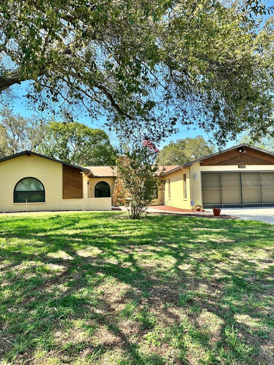 Welcome Home!!! This gorgeous 3 bedroom 2 bathroom salt water pool home, sits on a stunning .5 acre lot near shops, restaurants and 589. It's a short ride to the Tampa International Airport, beaches and only 15 minutes to Weeki Wachee Springs. As you walk in, you are greeted with a large open floor plan, beautiful double pane windows, a wood burning fireplace and a 3 panel sliding door that opens completely into the screened-in pool area. The spacious master bedroom is on the complete opposite side of the guest rooms and has an ensuite bathroom with a sit in shower and plenty of closet space. There is an additional bathroom near the guest rooms that has access to the pool area as well. Down the hall is a laundry room with full sized washer and dryer and the 2 car garage includes a workshop area and screened panels incase you want to keep the garage opened on the cooler nights or days. The home also has a large den behind the kitchen that can be used as a large formal dining area, office, play room or guest space.
The owner is the original owner and has kept this beauty in pristine condition!! The windows were replaced in 2012, a leaf filter was added in 2021 with a lifetime transferrable warranty and the shed in the backyard is also included!!!! Some of the furniture is also for sale if interested.
This home is perfect for entertaining family and friends but most importantly, it's a very peaceful, quiet and safe place to live! Schedule your showing appointments soon and Don't miss out on this gem!!