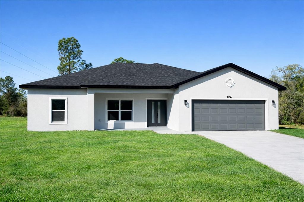 Photo of 10516 Caldera Ave Ave N, Citrus Springs, FL 34433 (MLS # O6381243)