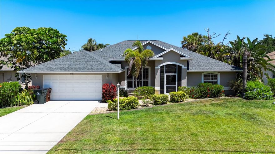 Welcome to this open and spacious 3 bedroom, 2 bath single family home with  2 car garage, ideally situated on a scenic freshwater canal in desirable Waters Edge Estates. This move-in-ready super clean gem offers a peaceful Florida lifestyle with plenty of upgrades and thoughtful touches. This home is so sunny and bright with many windows throughout. You'll love the screened lanai with a sparkling saltwater pool perfect for relaxing or entertaining. The cozy lanai furniture has been left for the buyer's convenience. Several rooms open directly onto the lanai creating seamless indoor-outdoor living. There's even a outdoor patio perfect for grilling or soaking up the Florida sunshine while overlooking the peaceful water views. The interior is a split plan design with a spacious primary suite designed for privacy. All appliances are included in the well-designed kitchen with breakfast bar that flows into a spacious family room. Even the washer and dryer are included in the indoor laundry area.  The large fenced backyard is ideal for privacy and pets, and the irrigation system draws from the canal making your yard maintenance a breeze. Newer updates include roof replacement, hot water heater, pool cage, gutters/soffits and more. Don't miss these added bonuses...no hazard flood insurance required (Flood zone X), no CDD, and low annual HOA fee!!! The property is connected to central water and has easy access to schools, shopping, restaurants, Sarasota Memorial Emergency and Care Center and I-75. Don't miss this opportunity to live in a serene waterfront setting close to many North Port amenities.