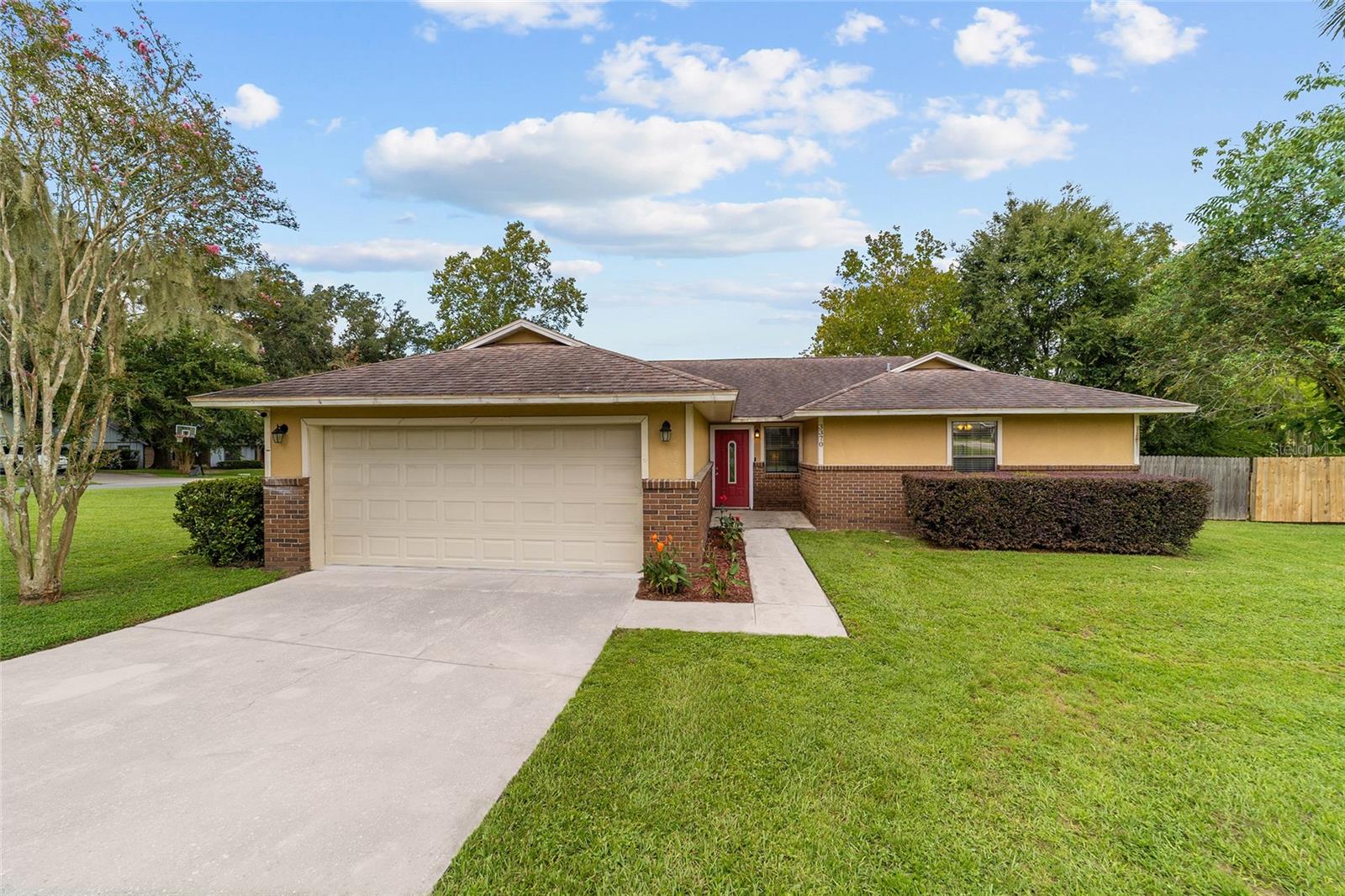 Beautiful 3/2/2 home situated on a large corner lot in the highly desirable Windstream neighborhood. This home features LVP flooring, updated stainless steel appliances, granite countertops, spacious bedrooms, indoor laundry, and a deep 2 car garage. Set up an office and work from home in the large primary suite that offers a separate sitting area. The primary suite has a walk-in closet and ensuite bathroom. Both bathrooms have double granite vanities with oversized mirrors stretching the length of the vanities. The spacious living area, boasting high ceilings and a fireplace, is a great area to relax. The living area leads out to the fenced in backyard with a gate. Schedule a showing to see everything this great home in one of Ocala’s most established neighborhoods has to offer.