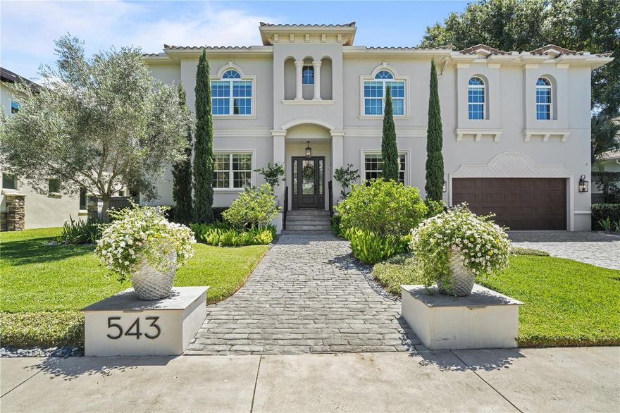 Under contract-accepting backup offers. NOW MORE REASON TO LOVE THIS BEAUTY!  A FABULOUS PRICE IMPROVEMENT! Situated on an idyllic street on the highly sought after, west side of Davis Islands awaits your new home. This two-story, ALL BLOCK home with a barrel tile roof, well-appointed landscaping, and pavered walkway presents an impressive residence. As you enter the gorgeous, etched glass door, note the 10 feet ceilings, crown molding, and travertine floors. To the left is an office, flush with natural light and double doors for privacy. It also has a large walk-in closet should you need a downstairs guest bedroom.  To the right, a large dining room provides the perfect setting for formal gatherings. For everyday meals, take a seat in the family dining room in the kitchen- it’s too spacious to call a nook, but it’s still cozy! Stainless steel appliances, a 6-burner gas range, spacious island and oversized fridge, make this kitchen a chef's dream! Off the kitchen is a fantastic family room to play a game or watch a movie. French doors lead to the expansive, covered porch with a built-in grill for true Florida entertaining.  You’ll feel like you’ve escaped to a private paradise with the Italian porcelain tile and lush landscape.  Feeling warm? Take a dip in the saltwater pool or relax on the sun shelf.  Back inside, venture upstairs. Note the natural light, crown molding and high ceilings you enjoyed downstairs, continue on the second level.  The primary bedroom provides plenty of space for a king-sized bed and extra furniture.  The bathroom offers an expansive vanity with two sinks, walk in shower and garden tub.  The walk-in closet is almost as large as a bedroom!  Down the hall, find an enviable laundry room with extra storage.  Each of the three bedrooms offer closets with shelving systems and full baths. At the end of the hall find a huge bonus room that can be anything your family needs!  Other features include IMPACT RATED windows, security system and cameras, surround sound, reverse osmosis system in the kitchen and whole home water softener system, landscape lighting a mudroom with storage, oversized 2 car garage and so much more!  The only thing missing is you!  Schedule your showing today.