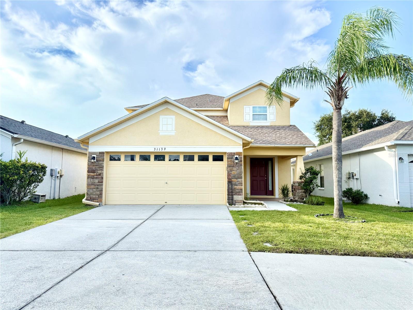 One or more photo(s) has been virtually staged. Welcome to 31139 Masena Dr – a beautifully maintained 5-bedroom, 2.5-bathroom home featuring a versatile loft and a 2-car garage, perfectly situated in one of Wesley Chapel’s most desirable communities. Enjoy serene water views right from your backyard and take advantage of resort-style amenities, including a large Multi Age Playground area, dog parks, Volley Ball Pit, Tennis Court and large covered seating area with tables and enough BBQ grills for a holiday picnic for everyone.
Inside, you’ll find a spacious and functional layout ideal for both entertaining and everyday living. The open-concept kitchen flows seamlessly into the main living area, while the upstairs loft offers additional flexible space for a media room, playroom, or home office. Roof replaced in 2020; all windows and sliding glass door upgraded to hurricane-impact in 2018.
Walking distance to top-rated schools, and just minutes from shopping, dining, and major highways, this home offers the perfect blend of comfort, convenience, and community living. Don’t miss this rare opportunity – schedule your private showing today!