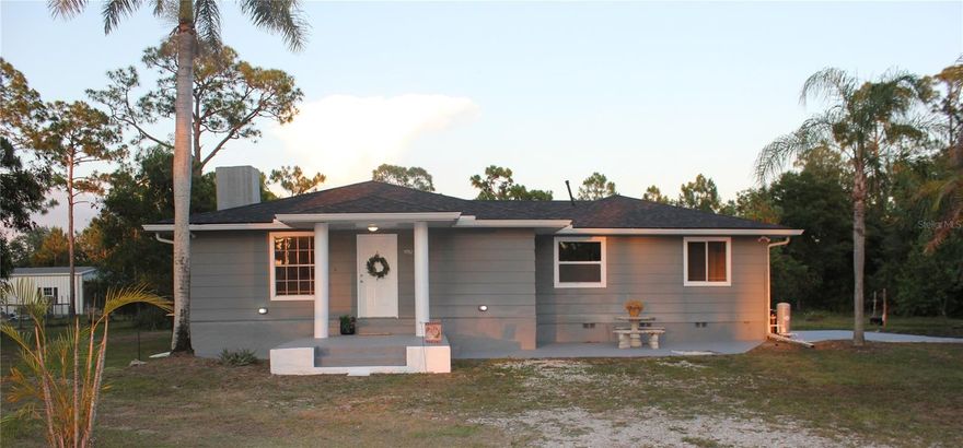 One or more photo(s) has been virtually staged. Welcome to "Old Florida Charm". Located on 1.25 acres this home feels warm and inviting when you pull up. Imagine a home close to an airport, food stores, restaurants and I-75. Oh! and on AG land. Well dream no more. This 4 bed/2Bath home has it all. Inside you will find cherry cabinets, granite tops, NEWER refrigerator, washer and dryer. Home has just been updated to an on demand hot water heater. Roof is only 3 years old. Large open family room and dining area and spacious kitchen. Living room has a gas fireplace with an additional room off of it to use as a bedroom, office, media room and comes with a walk in closet. The master is located on the rear of the house with a lg walk in closet and bathroom. Ceiling fans throughout, wood look porcelain floor tile throughout. Entire interior has been repainted in the last 4 months. Water comes from a well and has a water treatment hooked to it. Septic in back of house. 50amp RV hook up on right of home on the concrete pad. Chicken coop, goat pen on property. Storage shed and lien too on property.