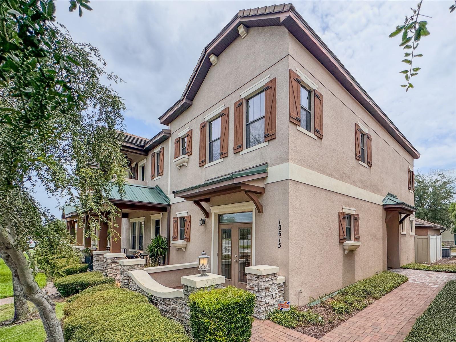 Excellent opportunity to own a luxury property in the heart of Windermere! gorgeous END UNIT townhome
with 4 Bedrooms/3.5 Bathrooms The floor plan offers 2 master bedrooms suite on the 1St floor and another on the second floor, both of them have a master bathroom features dual sinks and walk-in-closet. The first floor opens a well appointed kitchen with 42inch cabinets, a beautiful granite countertop with built in breakfast nook Which includes stainless steel appliance, natural gas stove, oven. The oversized 2 car garage offers plenty of storage space including access to the attic plus on street parking. Private fenced in courtyard with pavers. The second floor features 3 Bedrooms including Master bedroom suite and nice washer and Dryer in separate closed. You can literally walk to the shopping plaza(Publix, Panera bread, French café, STARBCKS Coffee, countless restaurants and much more) . Enjoy watching Them parks (magic kingdom)Fireworks views every day. Great location conveniently located to I-4,429 and Them parks. Call today to schedule your private showing and make this your new home sweet Home!