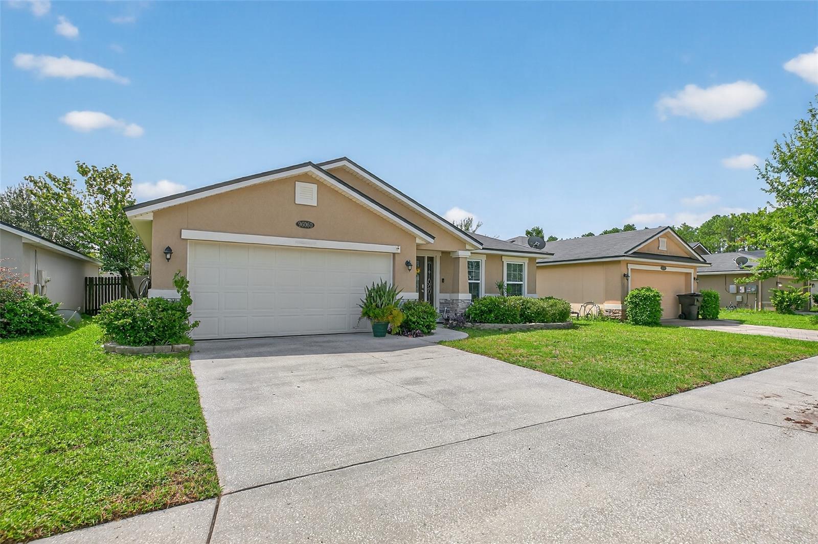 Welcome to this charming 3 bedroom, 2 bathroom home located in the desirable Heron Isles community. From the moment you arrive, you'll notice the inviting curb appeal and spacious two-car garage. Step inside to a generously sized living room that offers a warm and welcoming space to relax and unwind. The home features recently updated LVP flooring throughout the main living areas, providing both durability and modern appeal. All three bedrooms are finished with newer, soft carpeting that adds a warm and inviting touch. The kitchen flows seamlessly into the dining area and an additional family living space, creating an open-concept feel that's perfect for both everyday living and entertaining. Enjoy granite countertops, stainless steel appliances, a double basin sink, and plenty of cabinet and counter space to meet all your culinary needs. The owner's suite is tucked away off the dining area, offering a spacious walk-in closet and an en suite bathroom featuring a soaking tub,
walk-in shower, and double vanity, everything you need for comfort and functionality.
Two additional bedrooms are situated near the center of the home, each comfortably sized and ideal for guests, kids, or a home office. The centrally located laundry room, which includes the washer and dryer, adds convenience to your daily routine. The home also includes a newer HVAC system, installed just two years ago, ensuring year-round comfort and energy efficiency.
Step outside through the sliding glass doors to a screened-in patio that is perfect for relaxing with your morning coffee or hosting friends and family. The fully fenced backyard offers privacy and plenty of room for pets, play, or even a garden. It is a great space to enjoy the outdoors from the comfort of home.
Residents also enjoy access to a nearby playground, perfect for families and outdoor fun. With Amelia Island just a short drive away and everyday essentials like restaurants, shops, and entertainment close by, this home offers the perfect balance of peaceful living and convenient access to everything you need.
Don't miss your chance to see it for yourself, schedule a tour today!