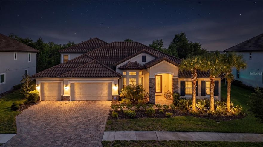 Step into a lifestyle of curated elegance in this former M/I model home, perfectly situated within the sought after exclusive gated enclave of Graybrook at Watergrass. Better than new, this five-bedroom, 4.5-bathroom masterpiece offers a rare blend of designer upgrades and functional luxury, balancing grand-scale entertaining with intimate daily living. Architectural highlights make a commanding first impression, featuring soaring 14-foot ceilings, bespoke custom woodwork, and designer lighting that accentuates the light-drenched, open-concept floor plan. At the heart of the home, the chef’s kitchen serves as a functional work of art, boasting an expansive quartz waterfall island, premium built-in appliances, and a generous walk-in pantry. Seamlessly transition outdoors through expansive sliders to your private sanctuary: a newer installed heated saltwater pool (2024) and extended patio. Set against a serene backdrop of protected, multi-acre conservation land, this property ensures absolute privacy with no rear neighbors, creating a tranquil, resort-style setting for relaxing or hosting. The thoughtful layout is designed for maximum flexibility, featuring a luxurious primary retreat and three bedrooms, including a private guest bedroom with its own en suite bathroom—on the main floor. Upstairs, a generous loft and an additional bedroom with en suite bathroom provide flexible space for guests, a media room, second office or multigenerational living. As a resident of WaterGrass, you’ll enjoy resort-style amenities including three community pools — a zero-entry resort style pool currently being converted to a heated pool, a lap pool, and a traditional pool, plus a splash pad, tennis courts, coming-soon pickleball courts, clubhouse with fitness center, pavilion, dog park, and numerous parks, including one just steps away across from the home in Graybrook, making outdoor living truly effortless. Convenience is unmatched with I-75 just minutes away and everyday essentials like Publix, Starbucks, Chase bank, and professional offices just down the street. Top-rated schools, including Watergrass Elementary, Kirkland Ranch Academy of Innovation, and Innovation Preparatory Academy, are just moments away. The home’s prime location also offers easy access to Tampa Premium Outlets, The Shops at Wiregrass, KRATE at the Grove, top hospitals, and an array of dining and retail options. Discover the unparalleled blend of luxury, convenience, and community living in this exceptional home.
Don’t miss the opportunity to make it yours, schedule your private tour today! **View the social media video and immersive 3D tour for the complete home experience**