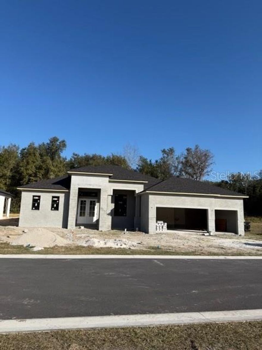 Under Construction. Gorgeous, new pool home in South Lakeland subdivision! Open, spacious split floor plan with 4 bedrooms and 3 full baths!  Stunning beam ceilings in great room & tray in master bedroom. Wood tile floors throughout, except bedrooms! The kitchen features upgraded cabinets, bar area, upgraded appliances, stone counter tops, and lots of counter space. Custom closets included. Beautiful screened pool area with oversized lanai overlooking wooded area! Top quality home tastefully designed by an interior decorator! Realtor/Owner.
