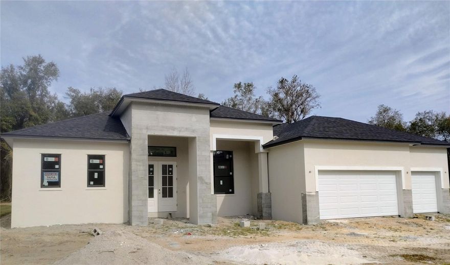 Under Construction. Gorgeous, new pool home in South Lakeland subdivision! Open, spacious split floor plan with 4 bedrooms and 3 full baths!  Stunning beam ceilings in great room & tray in master bedroom. Wood tile floors throughout, except bedrooms! The kitchen features upgraded cabinets, bar area, upgraded appliances, stone counter tops, and lots of counter space. Custom closets included. Beautiful screened pool area with oversized lanai overlooking wooded area! Top quality home tastefully designed by an interior decorator! Realtor/Owner.