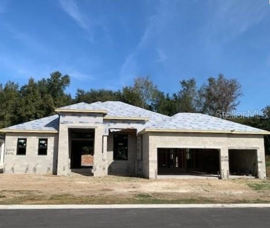 Under Construction. Gorgeous, new pool home in South Lakeland subdivision! Open, spacious split floor plan with 4 bedrooms and 3 full baths!  Stunning beam ceilings in great room & tray in master bedroom. Wood tile floors throughout, except bedrooms! The kitchen features upgraded cabinets, bar area, upgraded appliances, stone counter tops, and lots of counter space. Custom closets included. Beautiful screened pool area with oversized lanai overlooking wooded area! Top quality home tastefully designed by an interior decorator! Realtor/Owner.