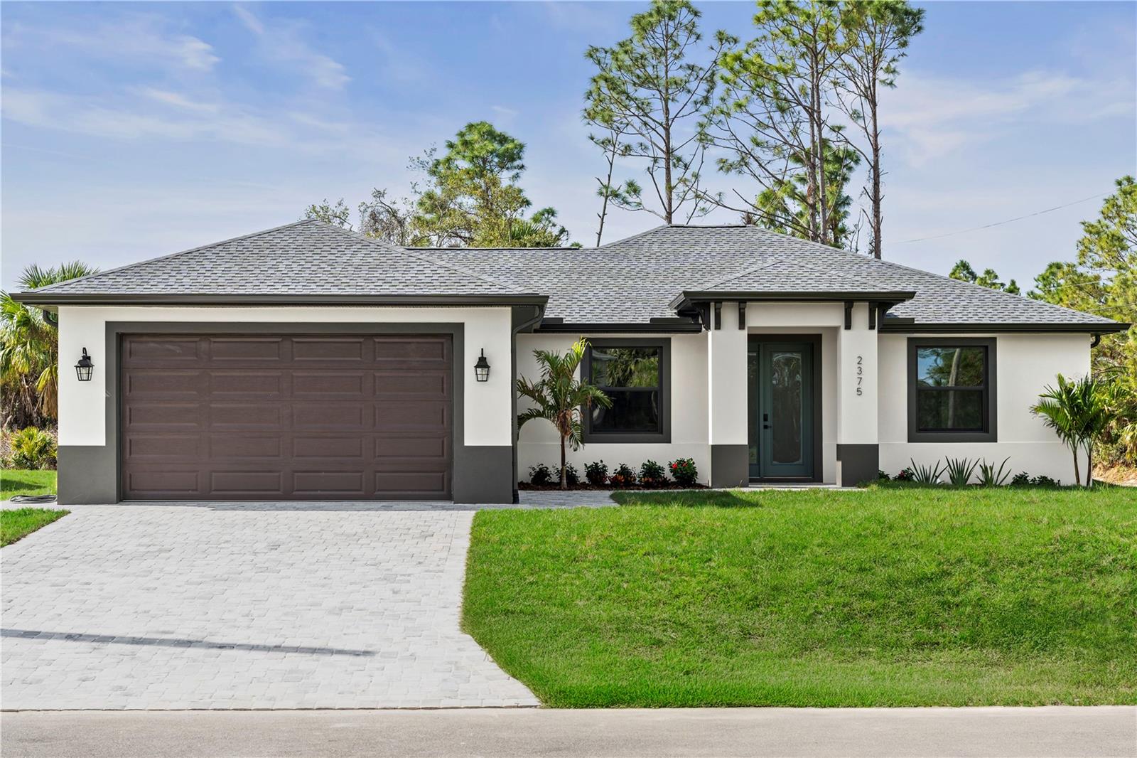 New Construction 2025 Built and Move-in Ready home is waiting for you. Upon entering, you'll fall in love
with this beautifully crafted Custom 3 Bedroom + DEN/OFFICE, 2 full bathrooms home where nothing was overlooked in
designing and finishing this home. The home features a bright open floor plan that’s perfect for entertaining family and
friends. The expansive den is flexible and can be used as a 4th bedroom to create the perfect setting for your family.
PORCELAIN TILE THROUGHOUT the entire house provides a soothing flow that everyone desires. Cooking will be a
dream in the gourmet chef’s kitchen with OVERSIZED QUARTZ ISLAND and countertops, UPGRADED PREMIUM
STAINLESS STEEL APPLIANCES, 42” SOLID WOOD SHAKER CABINETRY, MARBLE BACKSPLASH, and a Walk-in pantry.
The large Master bedroom sanctuary includes ample natural light and a Private Slider to lanai. The Breathtaking En-
Suite master bath has a designers touch with large format tile in the shower, SOAKING TUB, QUARTZ COUNTERTOPS
with DUAL SINKS are highlighted with LED MIRRORS and tiled backsplash. This Energy efficient home has HEAVY DUTY
HURRICANE IMPACT WINDOWS AND SLIDERS and DOOR, UPGRADED 4" LED RECESSED LIGHTING with CUSTOM MODERN
DESIGNER LED lighting fixtures and ceiling fans throughout. EURO STYLE PAVERS IN Driveway and Lanai, Irrigation
system is included in both front and back lawns, and Epoxy floors in the garage. Chern Construction Provides the
homeowner a peace of mind with a 1 year builder warranty. It's located in Prime area of growing city of North Port,
close to shopping and dining, and just a short drive to pristine blue water sandy beaches of FL! NO HOA, NO CDD Restrictions, NOT IN FLOOD ZONE
so take the next steps in fulfilling the dream of owning this home. Not in Food Zone,