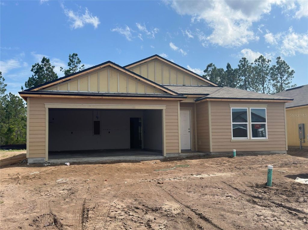 Photo of 76 Hulett Woods Road S, Palm Coast, FL 32137 (MLS # FC300787)