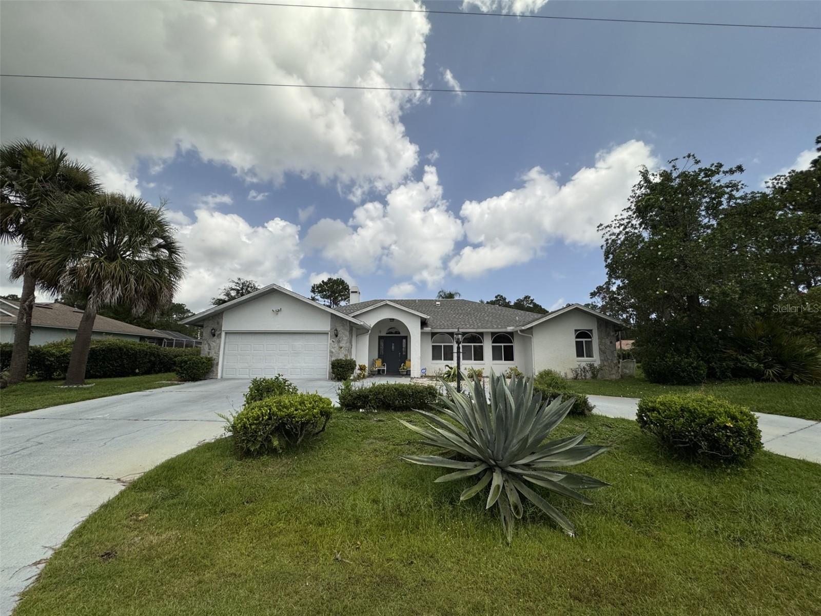 PRICED TO SELL – PRIME CORNER LOT LOCATION! Don’t let the age of this home keep you from discovering its incredible potential. With 2,243 sq ft of living space, this property offers room to grow and make it your own with just a touch of love. Featuring 3 spacious bedrooms and 2 full bathrooms, this home includes a large family room and a formal dining room, perfect for both everyday living and entertaining. The breakfast nook, filled with natural light from three windows, along with three sliding glass doors—one in the master bedroom and two in the main living area—seamlessly connect the indoors to the outdoors. The beautiful windows in the living room also provide beautiful natural light, offering a lovely view for the entire living and formal dining room. The master suite includes dual vanities—his and hers—for added convenience and privacy. The guest bathroom has direct access to the backyard, making it ideal for outdoor gatherings. Enjoy the Florida lifestyle year-round in the screened-in patio, a perfect setting for BBQs and relaxing afternoons. Thinking of adding a pool? This home is pool-ready, with space already available to create your private oasis.
Located in one of Palm Coast’s most desirable and central neighborhoods, you’ll be close to all the essentials—shopping, dining, parks, and more. The beautiful corner lot and circular driveway not only enhance curb appeal but also a plenty of parking, making it easy to host friends and family. This is your opportunity to own a spacious, well-located home at an unbeatable price. Come see the potential for yourself! Schedule your private showing today! Don't miss this opportunity-it won't last long on the market!!! All measurements are estimates only and should be verified by Buyer and/or Buyer Representative