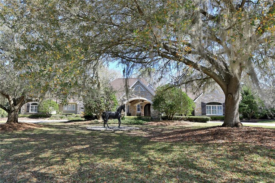 Elegant Entertaining Estate in the Country Club of Ocala.  
Situated on over two beautifully landscaped acres within the Country Club of Ocala, this exceptional residence offers refined French Country interiors, remarkable architectural details, and thoughtfully designed spaces ideal for both everyday living and elegant entertaining.  Upon entering, guests are welcomed by an impressive foyer that opens to a gracious living room filled with natural light. The open-concept kitchen and family room create a warm and inviting gathering space, with expansive views overlooking the eighteenth fairway of the golf course, as well as the home’s spacious deck and sparkling swimming pool.  The chef’s kitchen is beautifully appointed with custom cabinetry, exquisite granite countertops, a large center island, and a raised bar with seating that seamlessly connects to the family room and outdoor entertaining areas.  The dramatic family room features a striking black stone fireplace, vaulted tongue-and-groove ceilings, Cypress beams, built-in cabinetry, and a private office accented with custom-designed iron doors.  A versatile media room provides flexible space for a man cave, billiards room, or fitness area, with direct access to the luxurious owner’s suite. The spacious primary retreat includes a generous closet and dressing area, along with an elegant bathroom featuring dual facilities and a private laundry for added convenience.
Designed for effortless indoor-outdoor living, the screened pool area offers multiple spaces for dining, relaxation, and entertaining while enjoying serene golf-course views.  Additional highlights include a spacious garage with a bonus area and ample storage.
This remarkable property combines timeless elegance, comfort, and exceptional entertaining spaces in one of Ocala’s most sought-after golf course communities.