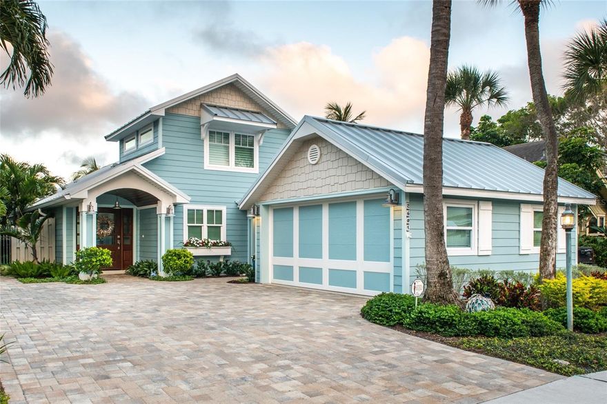 Welcome home to Paradise in Pass a Grille!  Here is a truly once in a lifetime opportunity to enjoy luxury waterfront living in this beautifully  designed and maintained beach home.  The attractive coastal architectural design and color palette will draw your attention to this exceptional property. Located on the intracoastal waterway and just a few short steps to the Gulf of Mexico & the Don Cesar. The exterior siding and trim are made of durable Hardie board planks and trim and the roof is a standing seam metal roof.  The exterior was recently painted in 2022 and all of the exterior light fixtures are new.  Upon entering you discover the home is thoughtfully equipped with countless upgrades and conveniences, as well as appealing design and decor.  There are vaulted ceilings and lots of windows that allow an abundance of natural light which, makes the home warm and inviting.  All windows and doors are impact rated and are trimmed with custom plantation shutters, roll-up blinds or decorative drapes.  Gorgeous hickory engineered hardwood flooring flows throughout the living space.  The kitchen features custom cabinetry, leather finish granite countertops, Kitchen Aid stainless steel appliances, a gas cooktop and breakfast bar seating.  The comfortable master suite includes a generous walk-in closet and an elegant bathroom with custom cabinets, granite countertop, a soaking tub and walk-in shower.  Additional features include a Sonos speaker system with interior and exterior speakers, a split Dutch door in the kitchen which allows the sea breeze to flow through the home and convenient pantry storage space under the staircase. The home is energy efficient with spray foam attic insulation and a newer Carrier Heat Pump equipped with a Reme Halo air purification system and a whole house water softener. Stepping outside, the shimmering water catches your eye as you stroll around this tropical oasis featuring a resort style pool, and a travertine paver deck. The salt water pool features a large sun shelf, and a new 400,000 btu natural gas heater.  The dock, lift (4500lb) and seawall were replaced in 2016.  There is plenty of parking on the oversized pavered driveway and there is an additional space on the North side of the property in the shelled portion of the city easement.  The nearly two car garage features and epoxy finished floor and a custom garage organization system.  This unique and impressive property offers the very best of the seaside, coastal lifestyle!