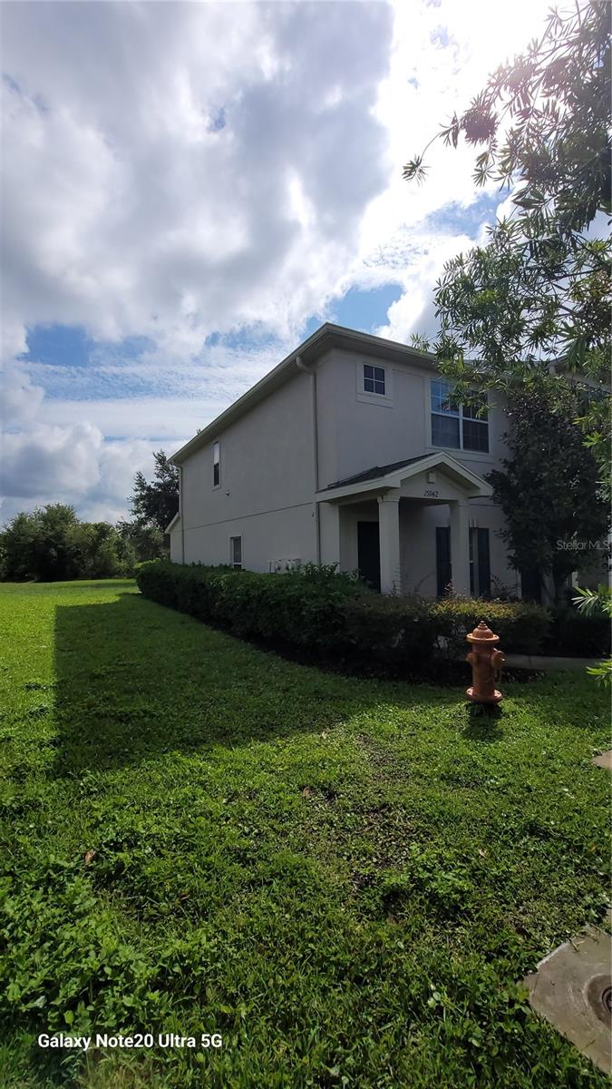 Beautiful 2 bed 2.5 bath townhouse in an attractive gated community with community pool in Spring Hill. Conveniently located at Hwy 52 and the Suncoast Parkway, with quick and easy access to Tampa. This end unit features a spacious living/dining room. The kitchen features cherry cabinets with crown molding, granite counter tops and stainless steel appliances. The bathrooms have granite counter tops and attractive brushed nickel features. All wet areas have 18inch tile. The laundry closet on the second floor has a Whirlpool washer and dryer. The double sliders from the kitchen/breakfast nook lead outside to the covered porch which overlooks the conservation area and pond to the rear of the property. Call today to schedule a viewing.