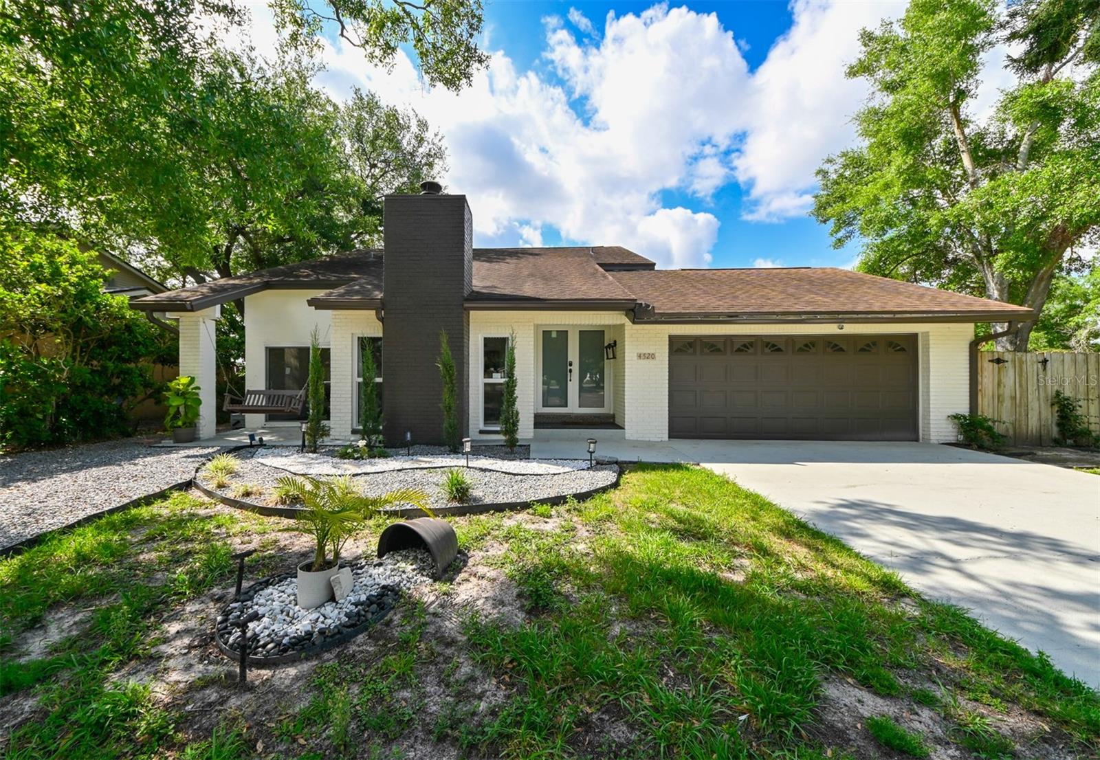 This fully renovated gem is packed with endless features—seeing is believing! Step into luxury and peace of mind with BRAND NEW, HURRICANE-RATED IMPACT WINDOWS AND DOORS, ensuring ultimate safety and energy efficiency. Nestled in the heart of Tampa, this EXPANSIVE ¼ ACRE CORNER LOT—one of the largest in the community—is ideally situated on a quiet cul-de-sac, offering serene pond views, added privacy, and plenty of space to relax or entertain outdoors.
Inside, you’ll be greeted by a modern, open layout with soaring 16-foot vaulted ceilings and high-end finishes throughout. The beautifully updated kitchen is both bright and inviting, featuring stunning quartz countertops, a classic subway tile backsplash, spacious center island, convenient passthrough wet bar/prep area, and brand-new stainless-steel appliances. Stylish, waterproof laminate flooring flows seamlessly throughout the home, offering durability and a sleek, cohesive look.
The downstairs layout perfectly blends open-concept living with defined spaces, creating a functional and welcoming atmosphere. The generous living room, anchored by a cozy fireplace, effortlessly flows into the large dining area, comfortably seating 8 to 10—perfect for hosting friends and family. Just off the kitchen, the family room boasts panoramic views of the peaceful pond, providing a serene backdrop for everyday living. A convenient half-bath completes this level.
Upstairs, the spacious primary suite features a beautifully designed ensuite bathroom, a walk-in closet, and breathtaking views of the pond. Both guest bedrooms are equally spacious and share a full bathroom, offering their own stunning views.
Step through the brand-new, hurricane-rated impact sliding doors onto your expansive covered lanai—an ideal canvas to create the outdoor oasis of your dreams. The oversized lot provides ample room for entertaining, gardening, play areas, or even a future pool.
Additional upgrades include a new HVAC (2022), fresh interior and exterior paint, new baseboards/trim, removed popcorn ceilings, upgraded lighting and plumbing fixtures, new door hardware, all new windows and doors (2025), new appliances (2025), a remodeled primary bathroom, refreshed landscaping, and a thoughtfully upgraded entryway. A full list of upgrades is available upon request.
Located in a friendly community with amenities like 2 pools, playgrounds, sports courts/fields, and walking trails, community events, and just minutes from top-rated schools, shopping, dining, and all of Tampa’s best attractions, this turn-key home offers the perfect blend of comfort, style, and space. Don’t miss this rare opportunity to own a stunning, move-in-ready home in one of Tampa’s most desirable neighborhoods!