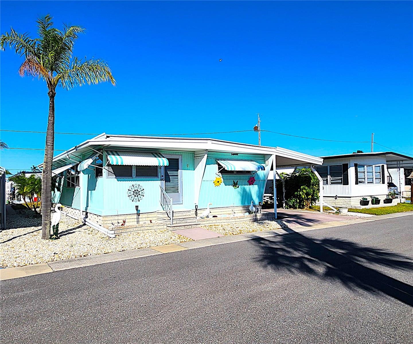OR BEST OFFER!
This TURNKEY mobile home located in the highly sought after community of Sunset Palms in Pinellas Park is being offered for sale fully furnished as shown in the photos including all window treatments, kitchen utensils, pots, pans, cups, plates, glasses, bedding, towels, (the Grandfather Clock does not convey; however, it is negotiable).
•The floorplan consists of an ample dining area and living room area.
•Kitchen is bright and spacious offering plenty of counterspace, refrigerator, dishwasher, electric stove & oven, exhaust fan, and countertop microwave.
•The master bedroom includes a private bathroom consisting of a walk-in tiled shower.
•An ample guest bedroom features built-in cabinets, ceiling fan.
•The guest bathroom includes a tub and shower and plenty of storage cabinets.
•Avoid the rain by conveniently parking in your carport which may fit up to two cars.
•A METAL ROOF in 2014.
•Utility room houses the washer, dryer, & water heater, tons of storage space; the bicycle also conveys with the sale.
•About Sunset Palms:
- An age restricted Resident Owned Cooperative community with approximately 520 shares each worth $55,000.
- Although the community is intended and operated for occupancy by persons fifty-five (55) years of age and older, occupants who are at least forty (40) years of age are also allowed as long as the main occupant/owner is 55 years of age or older.
- Children: If a child is born to, adopted by, or becomes a legal ward of a Resident, and the Board is informed, the Board of Directors will then, with written permission, allow the child to remain in the community for a period not exceeding six (6) months from the date of birth, adoption or custody.
- Pets: Although a no pet policy is in place, Service and Support Animas are the exception as defined in the American Disabilities Act, the Fair Housing Act & Florida Statutes Chapter 760.
- Sunset Palms is the perfect place to be your “home away from home” each year as it is located just 10 miles from the fine sandy beaches of Indian Shores and Madeira on the Gulf of Mexico; 2 short miles to Sawgrass Lake Park, and within steps from public transportation, retail, and restaurants and offers the following amenities among a few:
Heated pool and spa.
Fully equipped clubhouse with various activities.
Exercise room with billiards.
Active calendar of events including art classes, bingo, line dancing, karaoke, and shuffleboard.
Beautiful lake views and sunsets.
So bring your Golf Cart and move right in!