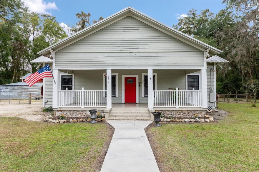 Built in 1920, this beautifully preserved and thoughtfully renovated 3-bedroom, 2-bath historic home offers the perfect blend of timeless character and modern convenience. Nearly every major system has been updated while carefully maintaining the charm of a 125-year-old home.
The completely remodeled kitchen (2023) features stainless steel appliances, granite countertops, backsplash, new cabinetry, and luxury vinyl plank flooring. Both bathrooms have been fully renovated with new subfloors, added exterior wall insulation, updated fixtures, and quality finishes, including a walk-in shower in the primary bath and a vintage clawfoot tub in the secondary bath. Each bathroom is equipped with modern, fog-free, dimmable mirrors for added comfort and functionality.
Luxury vinyl plank flooring has been added throughout the kitchen, one bedroom, both bathrooms, and the laundry room, while original heart pine wood floors and solid wood trim remain in the family room, dining room, and two bedrooms. The interior has been freshly painted, and new tongue-and-groove wallboards have been installed in multiple rooms, enhancing both insulation and historic character.
Major system improvements include a metal roof, updated electrical panel with no cloth wiring, completely redone plumbing with PVC piping, hot water heater, generator hookup, and a SpringWell whole-house water filtration system with UV. The HVAC system is existing, with a new AC fan motor installed in 2025. The attic has been updated with ECO Shield radiant barrier, plus added walkway access for ease of maintenance.
Structural improvements include Ramjack foundation stabilization with multiple pillars installed. Additional upgrades include replaced ductwork with added bedroom returns, Hardie board siding in key areas, exterior fans on the front and back porches, and new fencing with gates.
The fully fenced backyard offers exceptional privacy and versatility, featuring a barn with workshop, multiple chicken coops, and a 10x14 storage building with electricity — ideal for hobbyists, homesteading, or additional storage. Enjoy a charming front porch and a large screened back porch, perfect for relaxing or entertaining.
Modern utilities include Cox fiber internet, Duke Energy electric and Archer city water.
This is a rare opportunity to own a meticulously updated historic home with a private, usable yard and extensive upgrades already completed — blending peace of mind, comfort, and timeless charm.