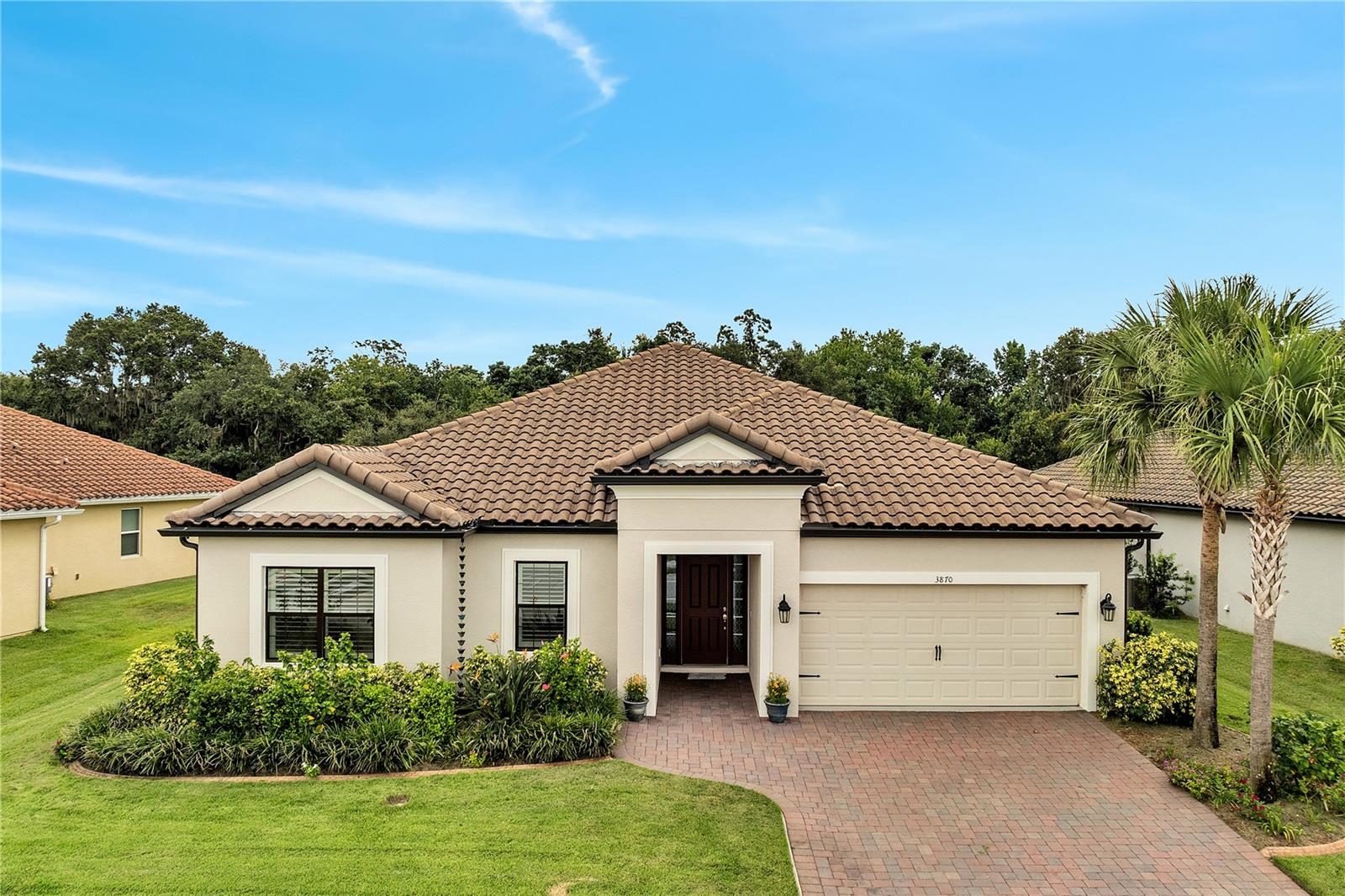 Step into resort-style living in this stunning 4-bedroom, 3.5-bath single-family home nestled in the sought-after gated community of Bellalago in Kissimmee, Florida. Built in 2022 and offering over 2,763 sq ft of heated space, this contemporary home combines modern elegance with functionality—ideal for families, first-time buyers, or anyone craving the perfect Florida lifestyle.
From the moment you enter, you're greeted with luxury vinyl flooring, elegant crown molding, and beachy shutter blinds throughout. The chef-inspired kitchen boasts a custom walk-in pantry with shelving, premium water filtration system, and designer finishes—perfect for hosting or winding down in style. Flowing seamlessly into the spacious living area is a tri-fold sliding glass door that opens to your fully oversized screened lanai, creating the ideal indoor-outdoor space.
Each bathroom features UV exhaust fans for enhanced comfort and efficiency. Enjoy the privacy of a split bedroom layout, with the primary suite offering spa-like serenity with a custom closet that enters into the back of the Laundry. Laundry features cabinets and rinse sink for all those messes. The oversized tandem garage provides ample space for storage, a home gym setup, or that golf cart to get around the resort community. Stay secure with your Ring doorbell camera and relax knowing you’re in a 24/7 manned gated community.
Located in Bellalago, a waterfront, amenity-rich haven along Lake Tohopekaliga, residents enjoy boating access, private docks, walking trails, championship fishing, a massive clubhouse, fitness center, pools with slide, tennis courts and so much more. You're minutes from schools, shopping, dining, and all the magic of Orlando.
If you’re ready to elevate your lifestyle and own a home that blends luxury, security, and outdoor recreation—this is it.