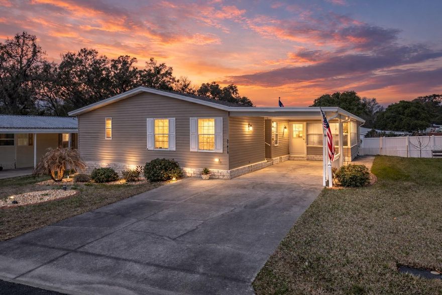 Easy living meets vibrant community life in this light-filled furnished 3 bedroom, 2 bath home tucked inside the gates of the Grand Horizons 55+ community- where you own the land! With spacious interiors, thoughtful updates, and close proximity to Zephyrhills’ favorite local hotspots, this home is designed for comfortable everyday living and easy entertaining. Upon arrival, you are welcomed by a convenient 2 car carport that keeps you protected from the Florida weather and leads directly into the enclosed Florida Room, or into the main living space. Inside, the combined 14x25 living and dining area provides plenty of room to spread out, host guests, or arrange furniture to suit your lifestyle. High ceilings, abundant windows, and luxury vinyl plank flooring flowing throughout most of the home create a cohesive and stylish feel. The eat-in kitchen connects seamlessly to the temperature-controlled Florida Room, making staying engaged with guests while preparing meals a breeze. Designed with functionality in mind, it offers ample cabinet storage, a large central island with breakfast bar seating, a generous pantry, ceiling fan, a 2023 Whirlpool convection oven, and a 2023 36 inch wide stainless steel sink. Just steps away, the laundry room doubles as an office space with a built-in desk, and the washer and dryer stay with the home for added convenience. The split bedroom layout provides privacy for everyone with the primary suite featuring spacious sleeping quarters, a massive walk-in closet, and an ensuite bath complete with dual sinks, a walk-in jetted tub, and a separate walk-in shower. On the opposite side of the home, bedrooms 2 and 3 both include vinyl flooring, ceiling fans, large closets, and easy access to the second full bathroom with a tub and shower combination. Relax and unwind in the enclosed Florida Room, meet neighbors at one of the many clubhouse events, take a dip in the sparkling community pool, or enjoy a friendly game on the shuffleboard courts. Grand Horizons offers an active lifestyle while keeping you close to shopping, dining, medical facilities, and everyday conveniences throughout Zephyrhills. Whether you are ready to simplify your space or embrace a more social and active chapter, this home offers the layout, location, and community to make it happen. Call today to schedule your private showing.